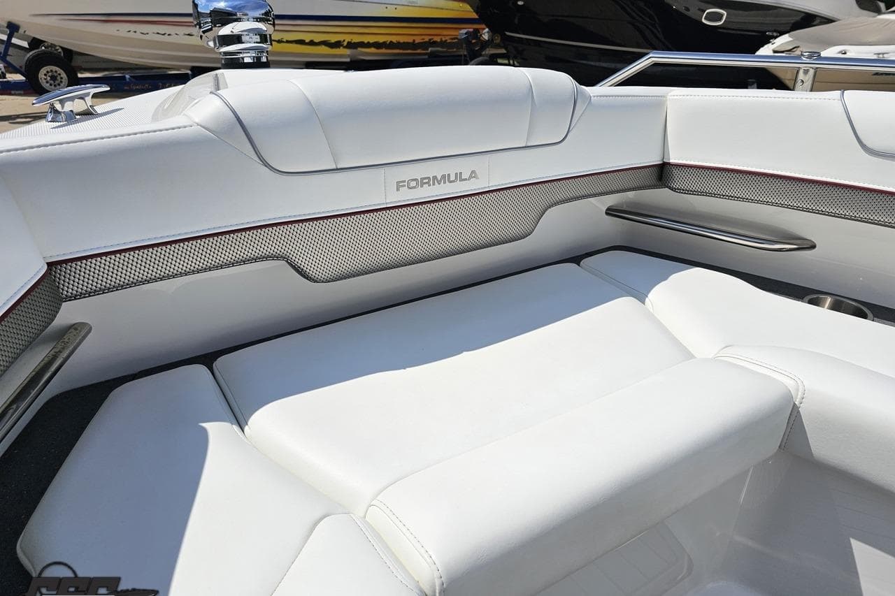 2020 Formula 330 Crossover Bowrider interior with white seating and sleek design.