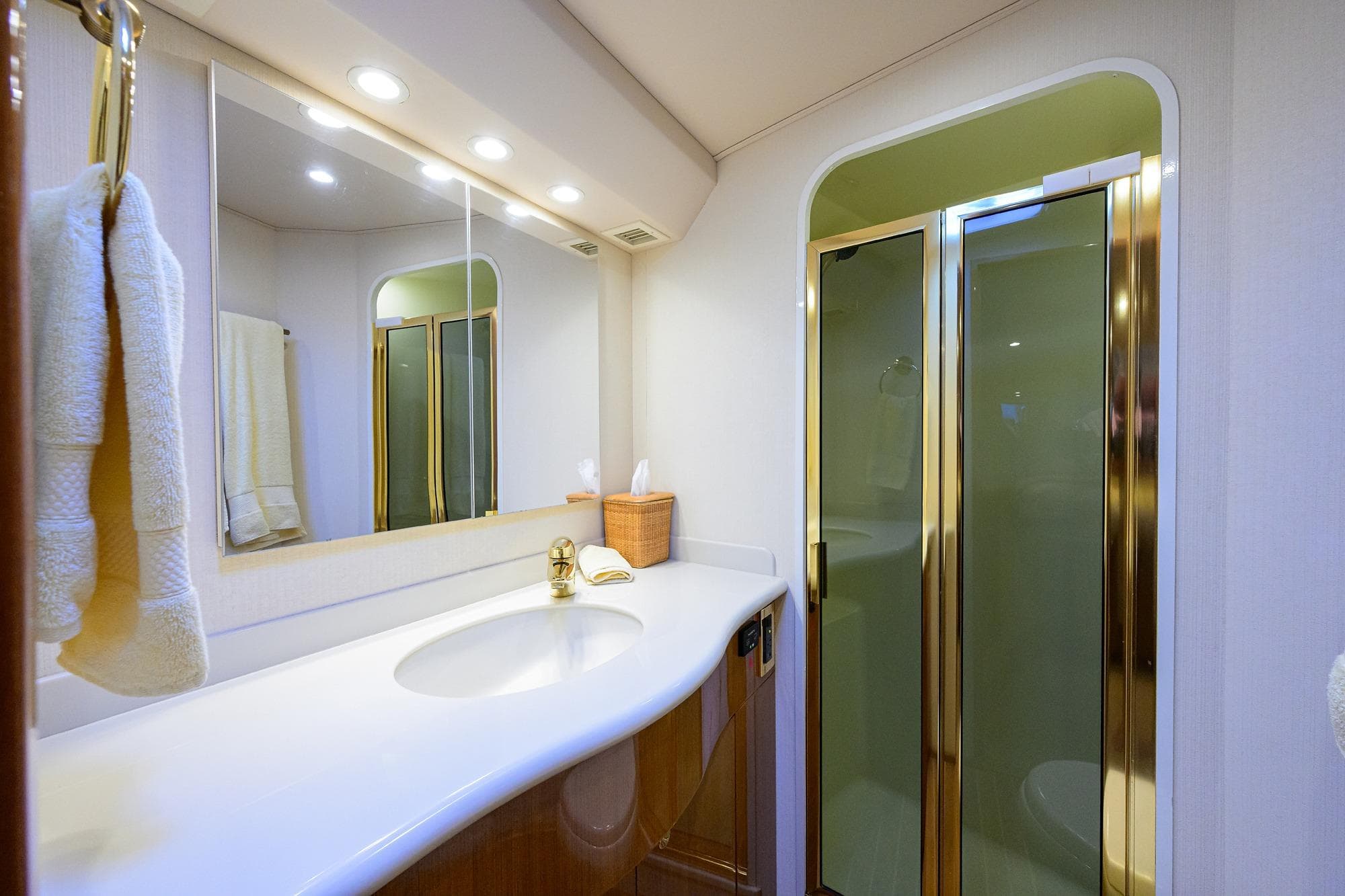 Luxurious bathroom in 2004 Viking 48 Convertible yacht with elegant fixtures and spacious shower.