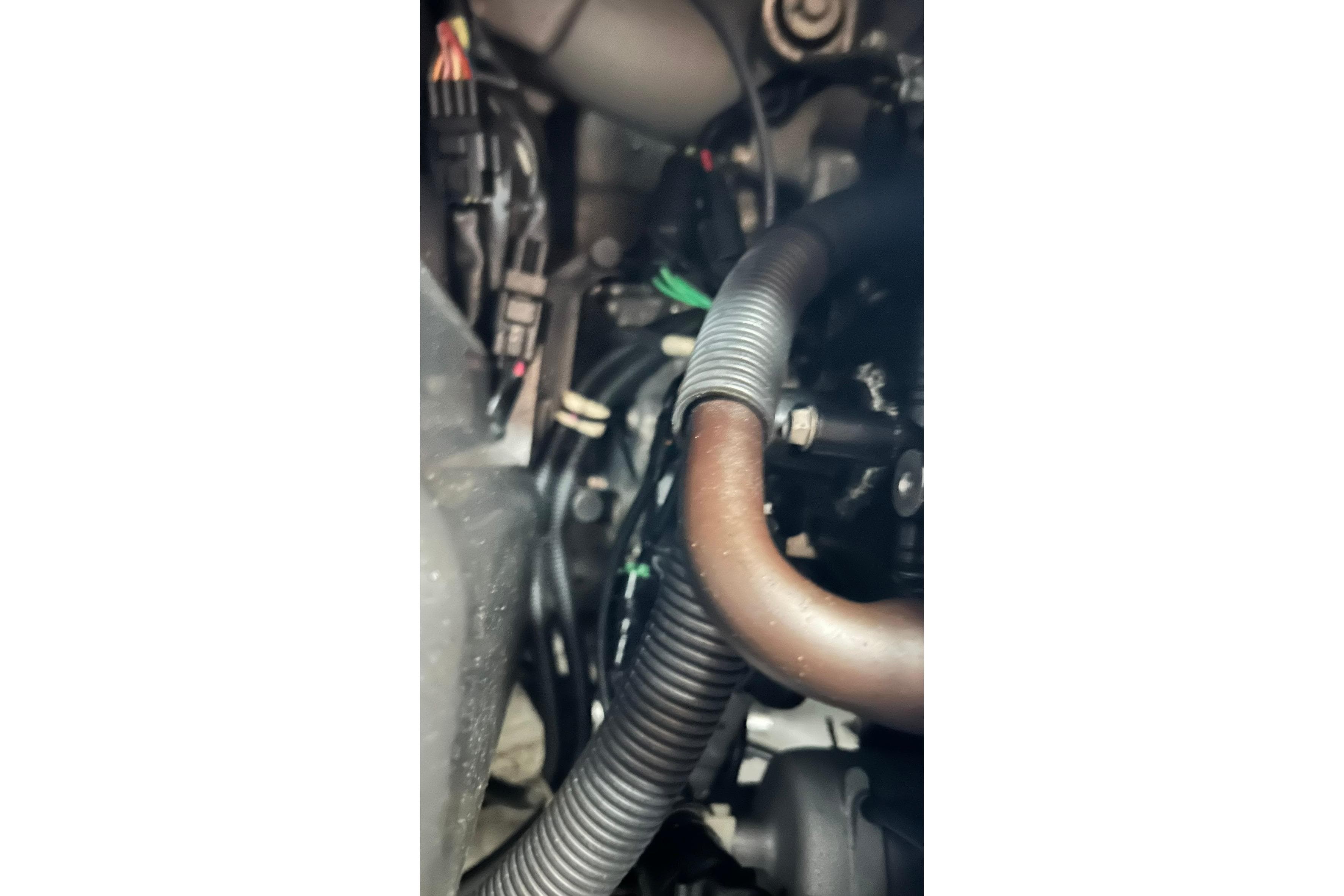 Engine components of a 2017 Yamaha WaveRunner FX Cruiser SVHO, featuring hoses and wiring.