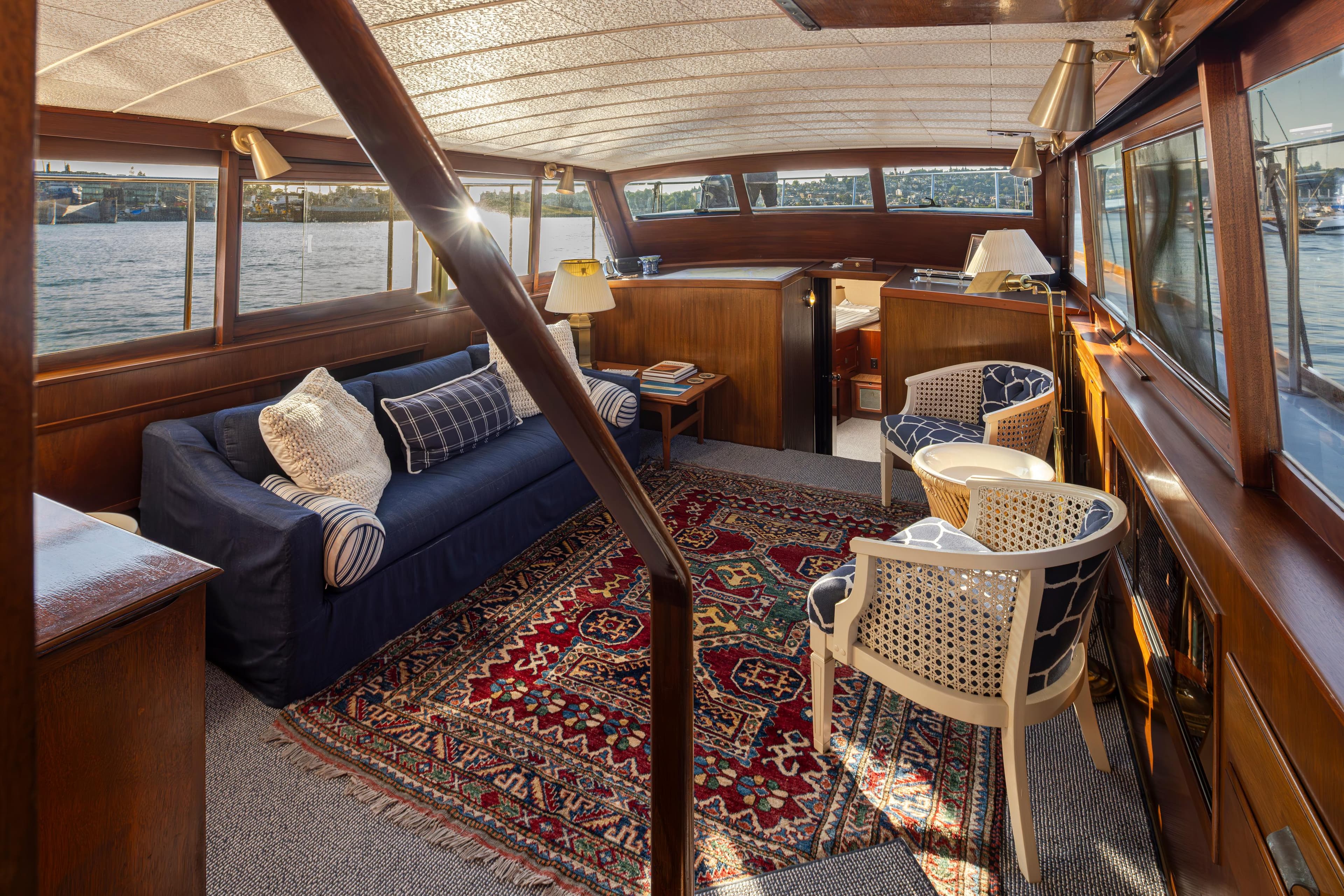 Interior of a 1965 Stephens Flushdeck yacht with cozy furnishings.