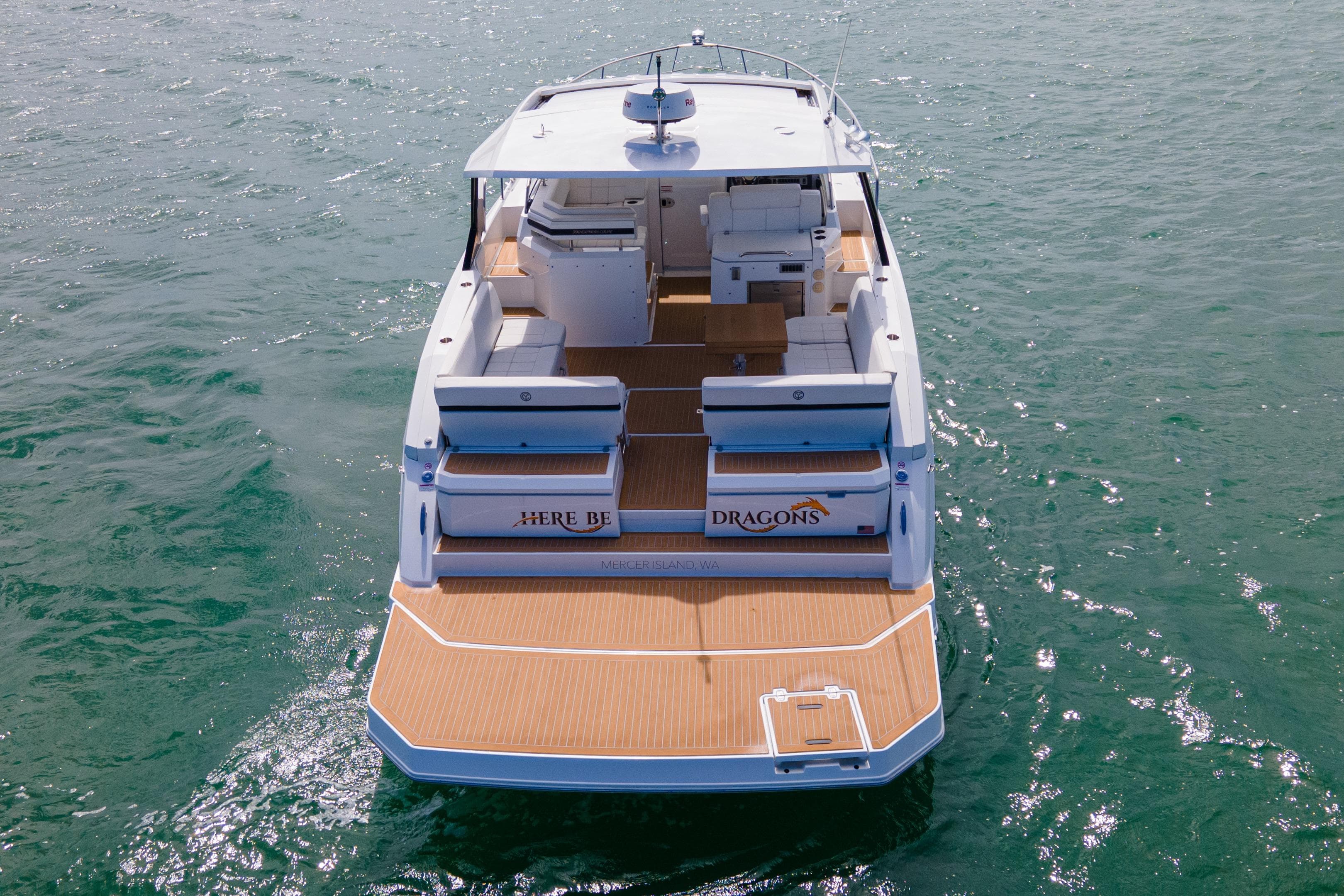 2018 Cruisers Yachts 390 Express Coupe on water, rear view, spacious deck.