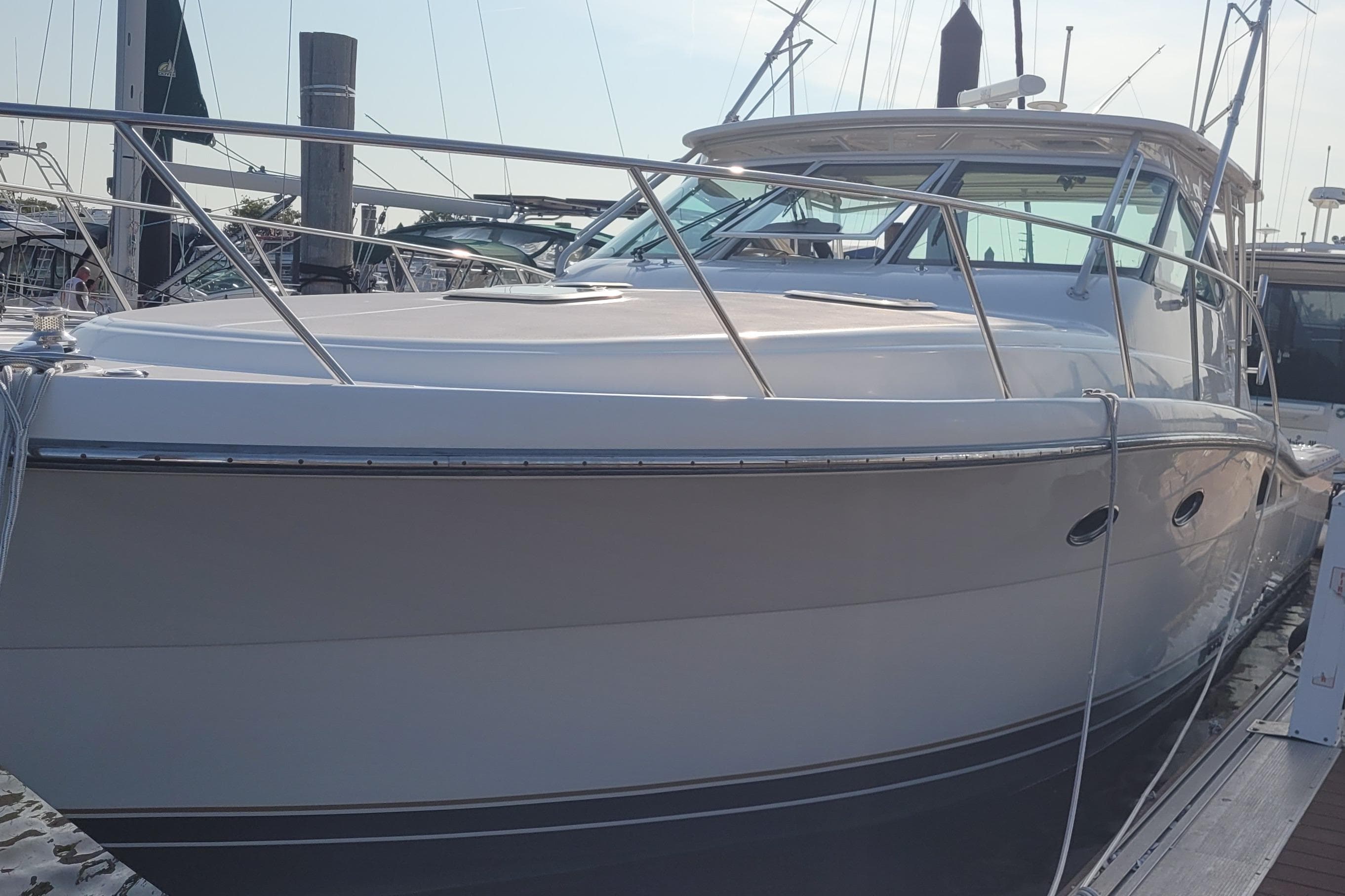 2006 Tiara Yachts 4200 Open docked at marina, sleek design, luxury vessel.