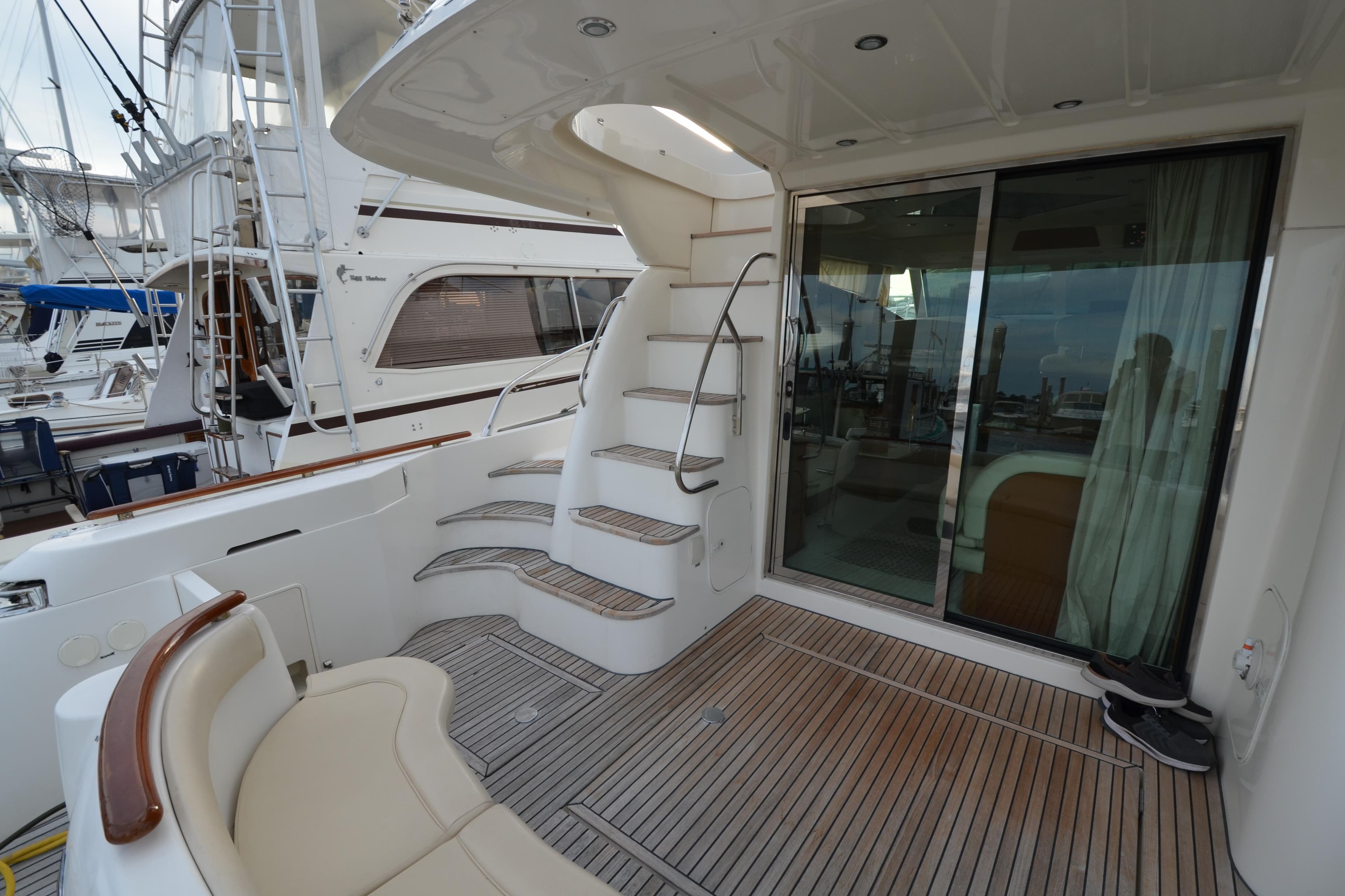 2007 Jeanneau Prestige 46 yacht deck with stairs and sliding glass door.