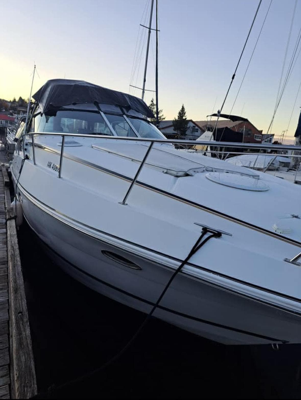 2001 Cruisers Yachts 3470 Express docked, showcasing sleek design and spacious deck.
