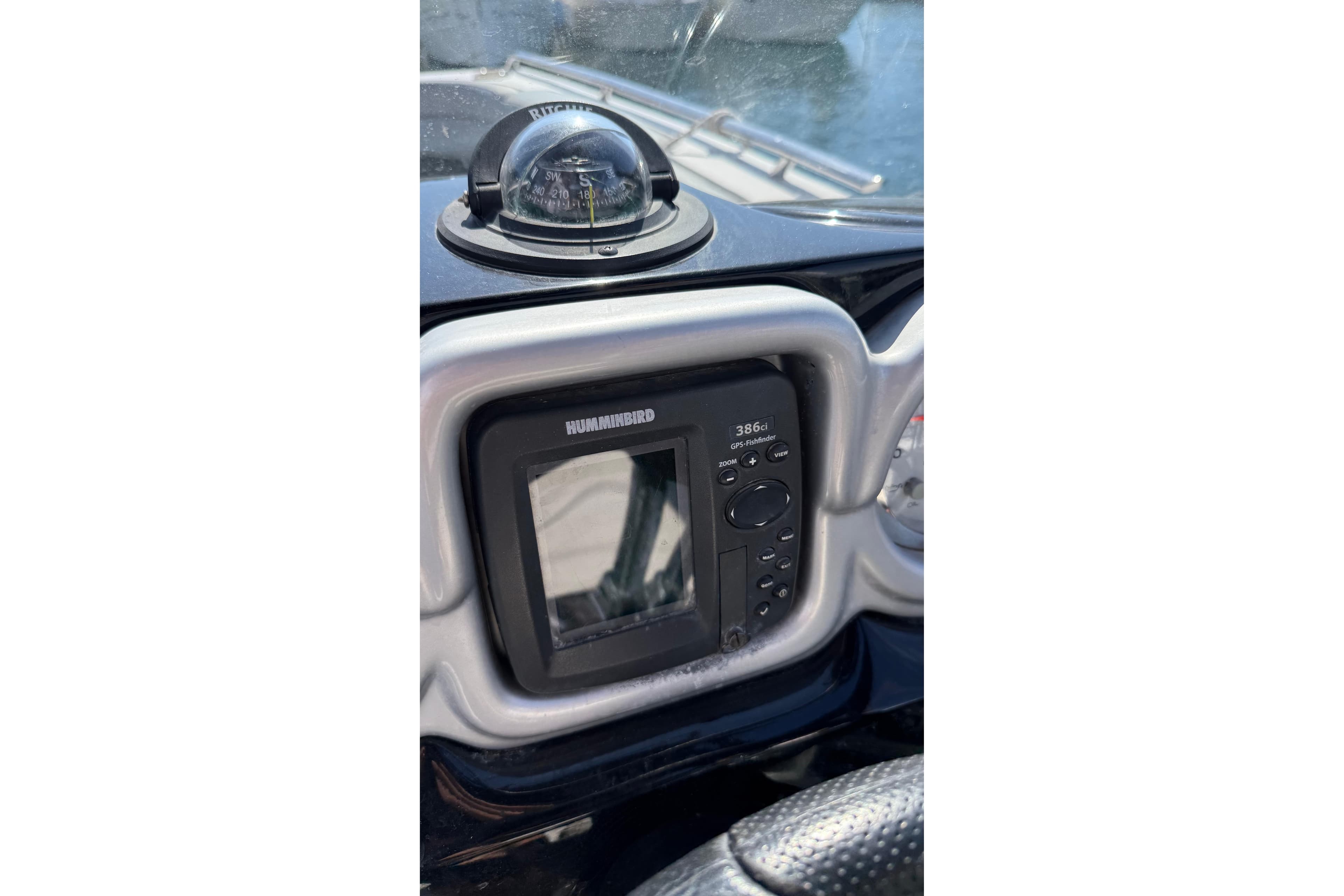 Dashboard of 2013 Starcraft Crossover 220 SCX IO with Humminbird GPS and compass.