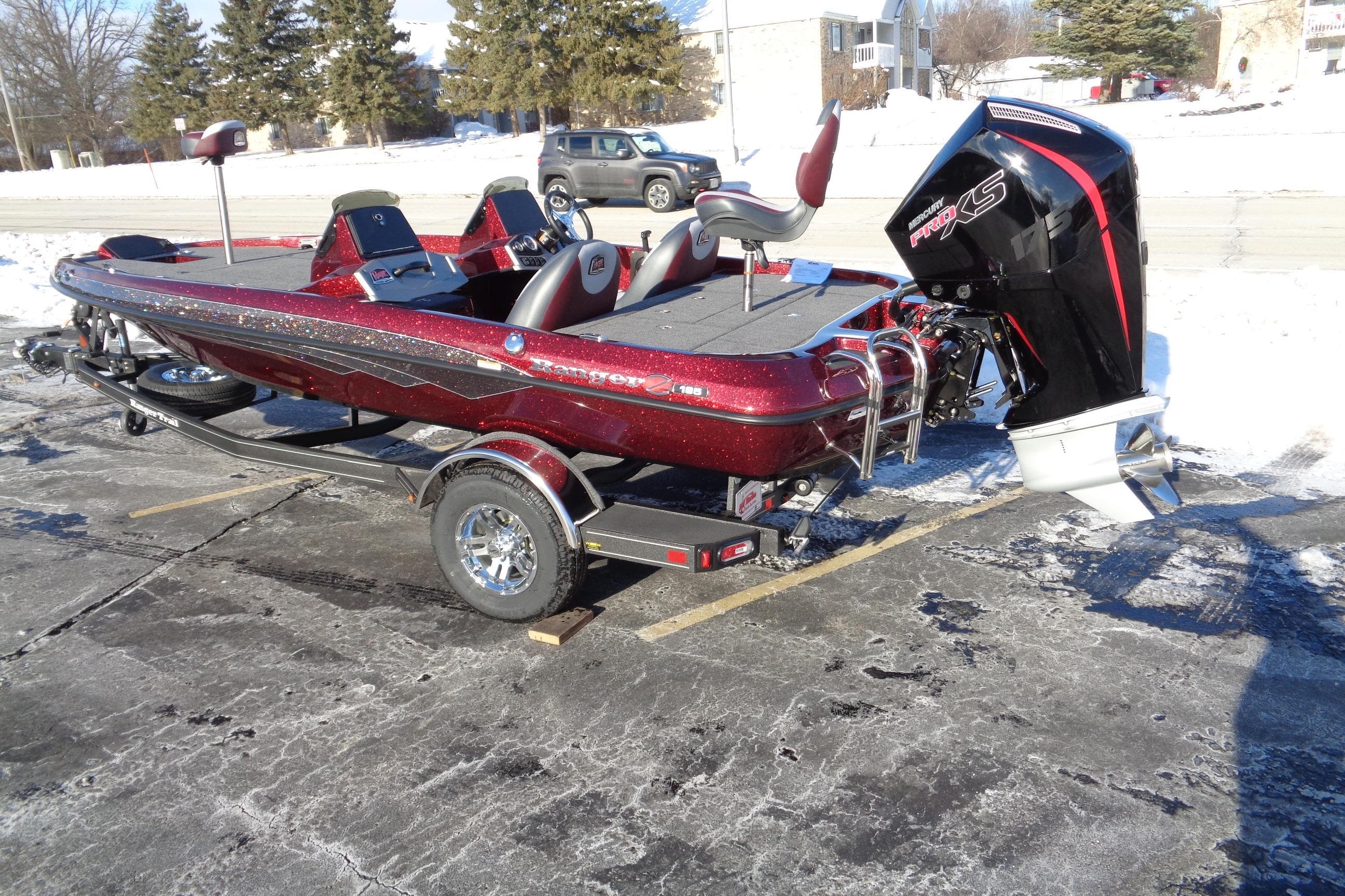 2026 Ranger Z185 boat with trailer, parked on snowy pavement.
