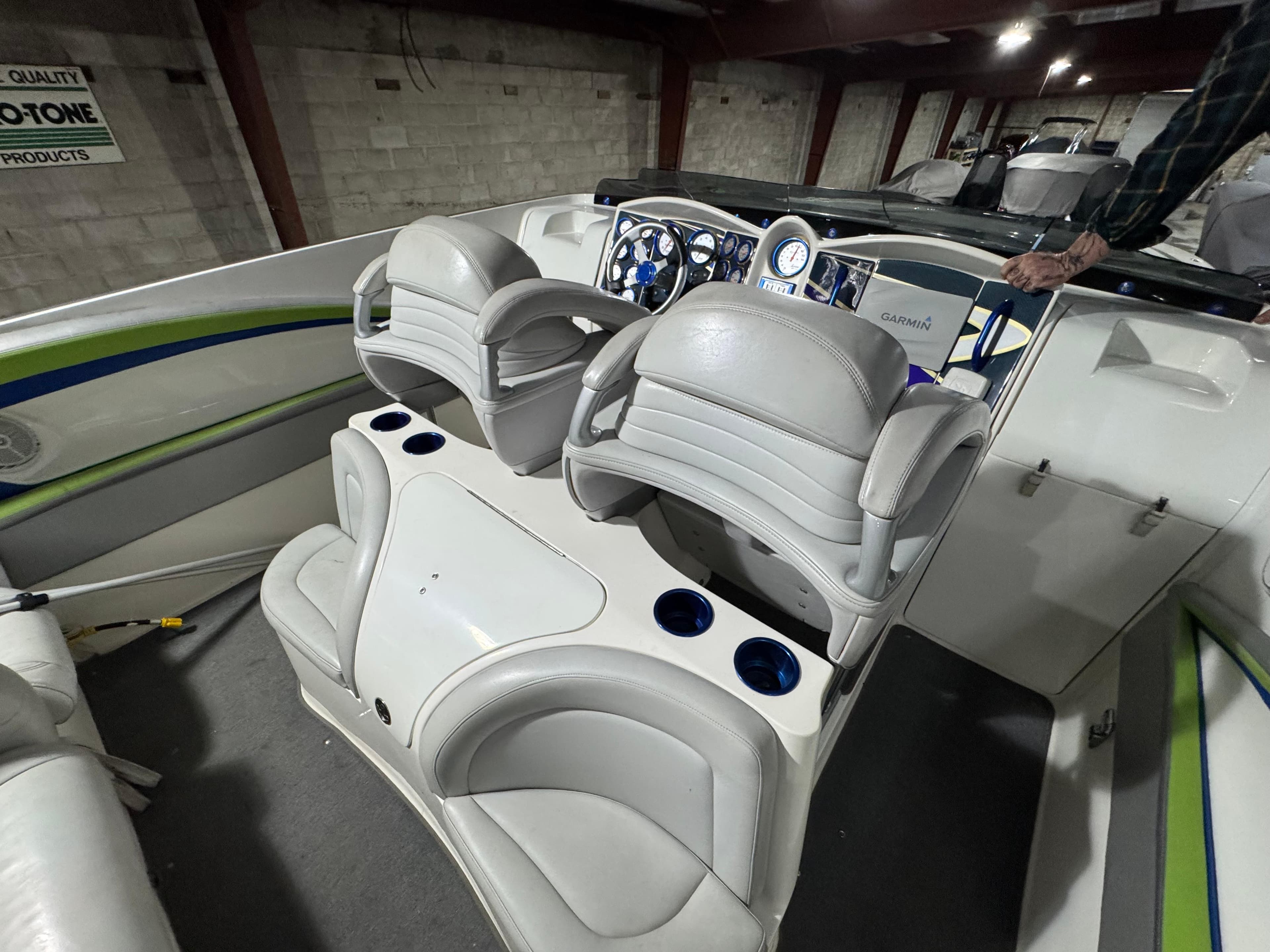 2006 MTI 44 Pleasure Cat boat interior with white seating and dashboard.