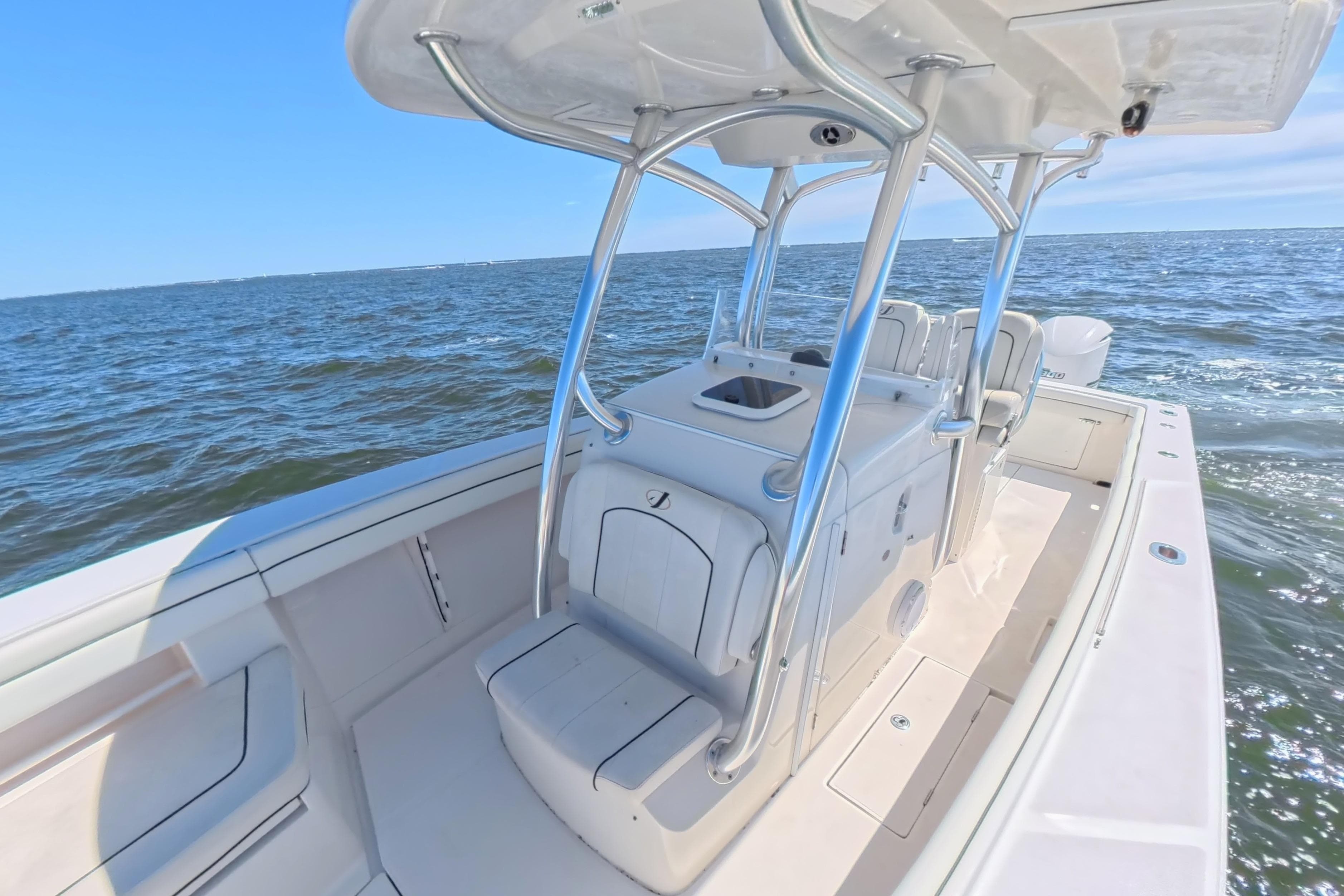 2014 Jupiter 30 FS boat on open water, featuring sleek design and spacious deck.