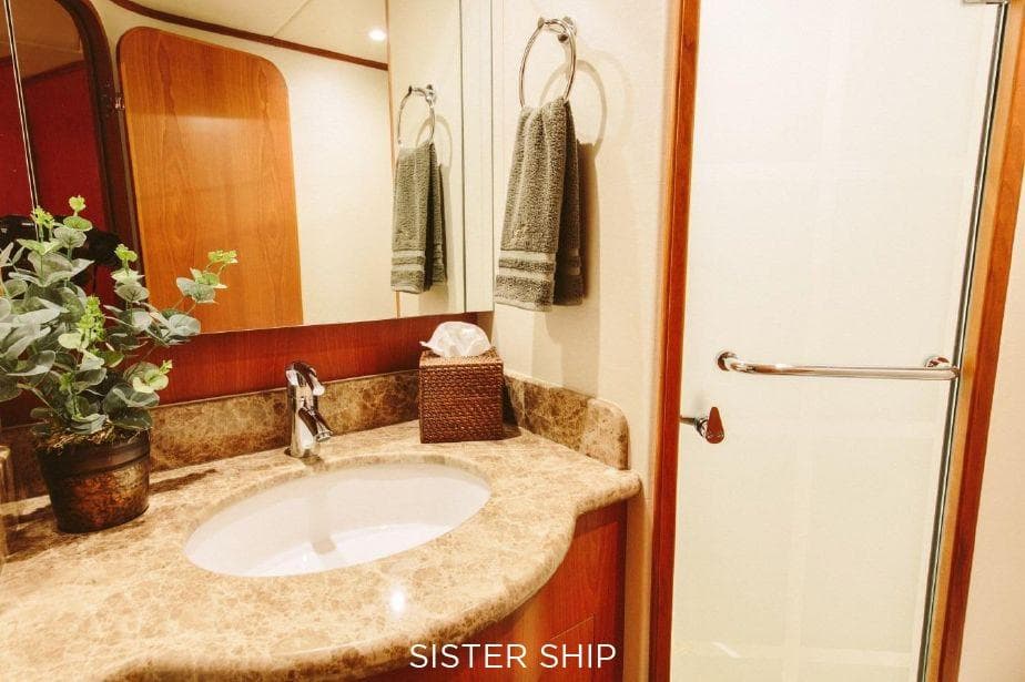 Luxurious bathroom in 2027 Outer Reef Yachts 880 Cockpit Motoryacht with elegant fixtures.