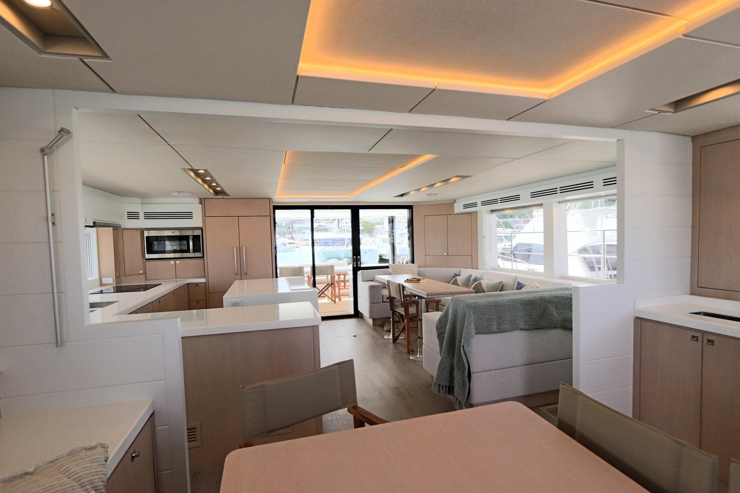 Luxurious interior of 2025 Two Oceans 55 yacht with modern kitchen and seating area.