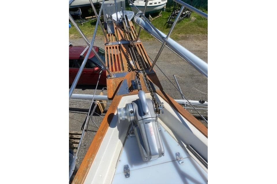 1988 Bayfield 36 Cutter sailboat deck with anchor chain and windlass.