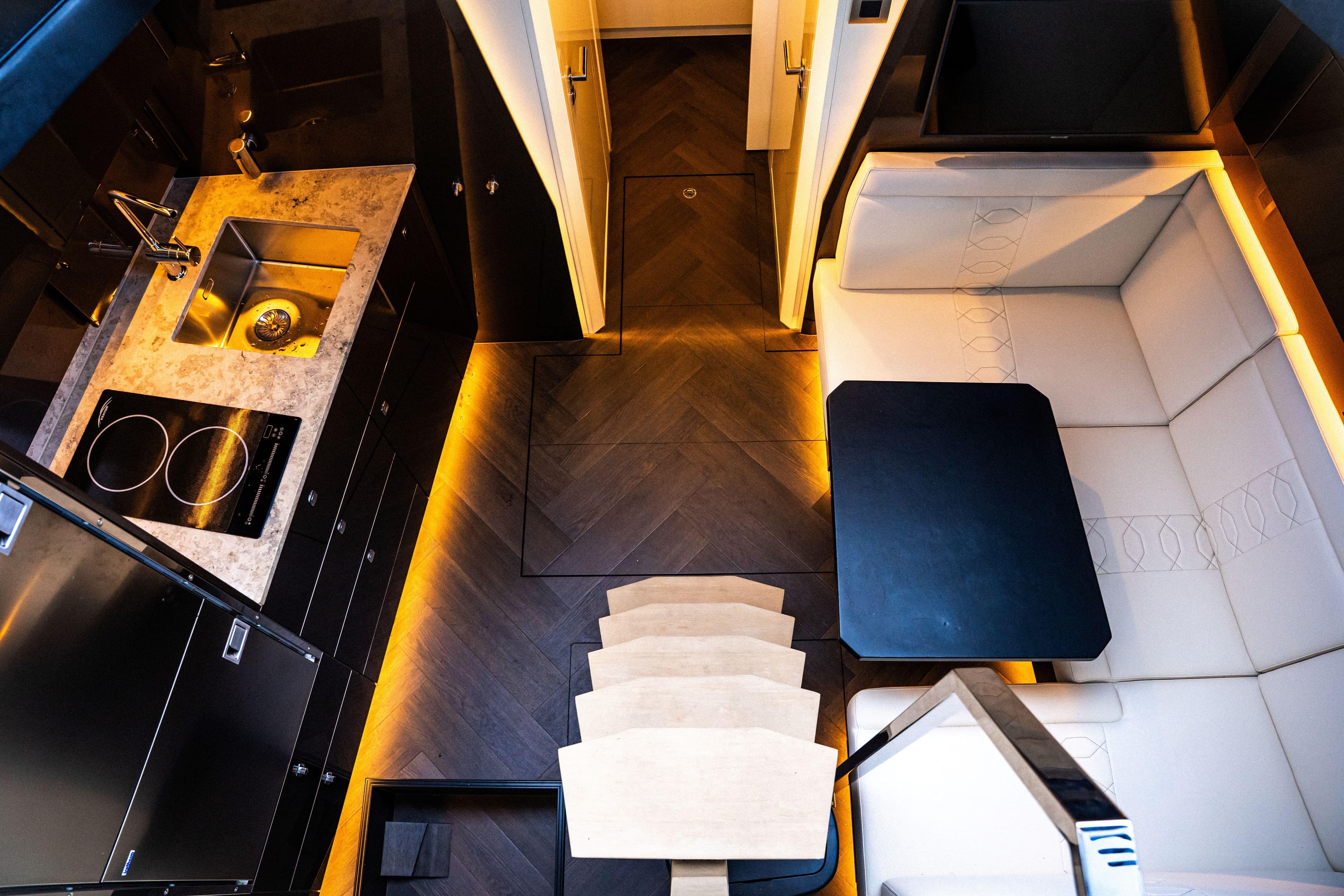 Luxurious interior of 2025 Dutch American DA 53 yacht with modern kitchen and seating area.