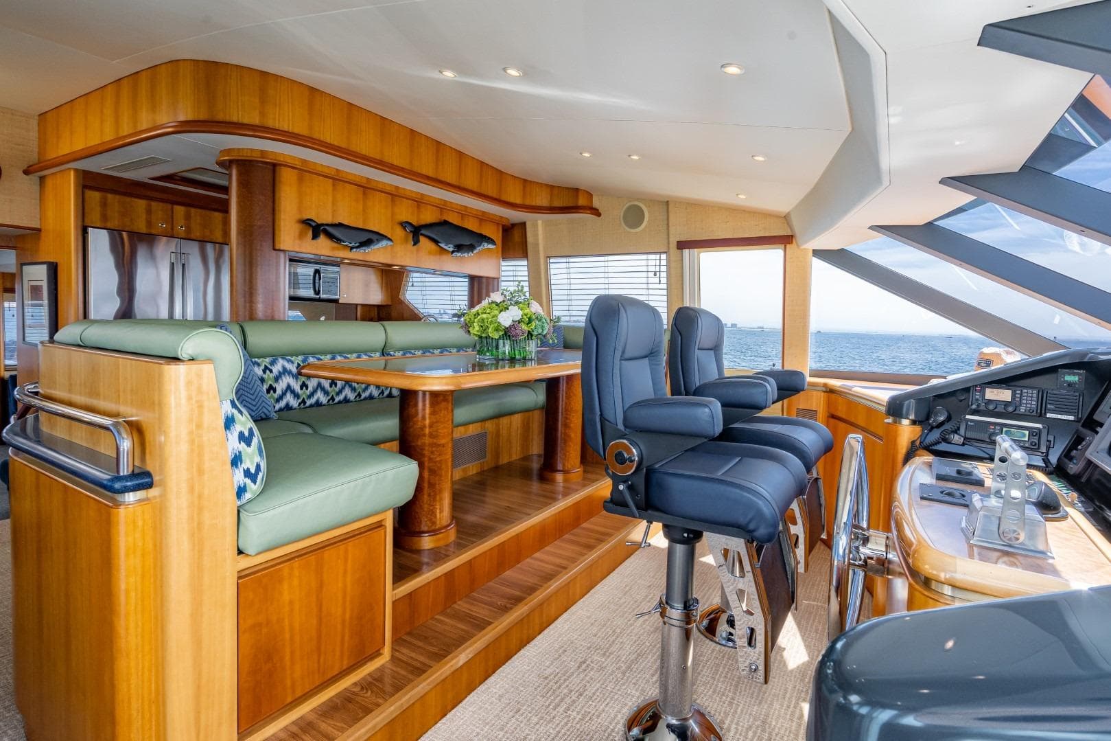 Luxurious 2001 West Bay SonShip Pilothouse interior with elegant seating and ocean view.