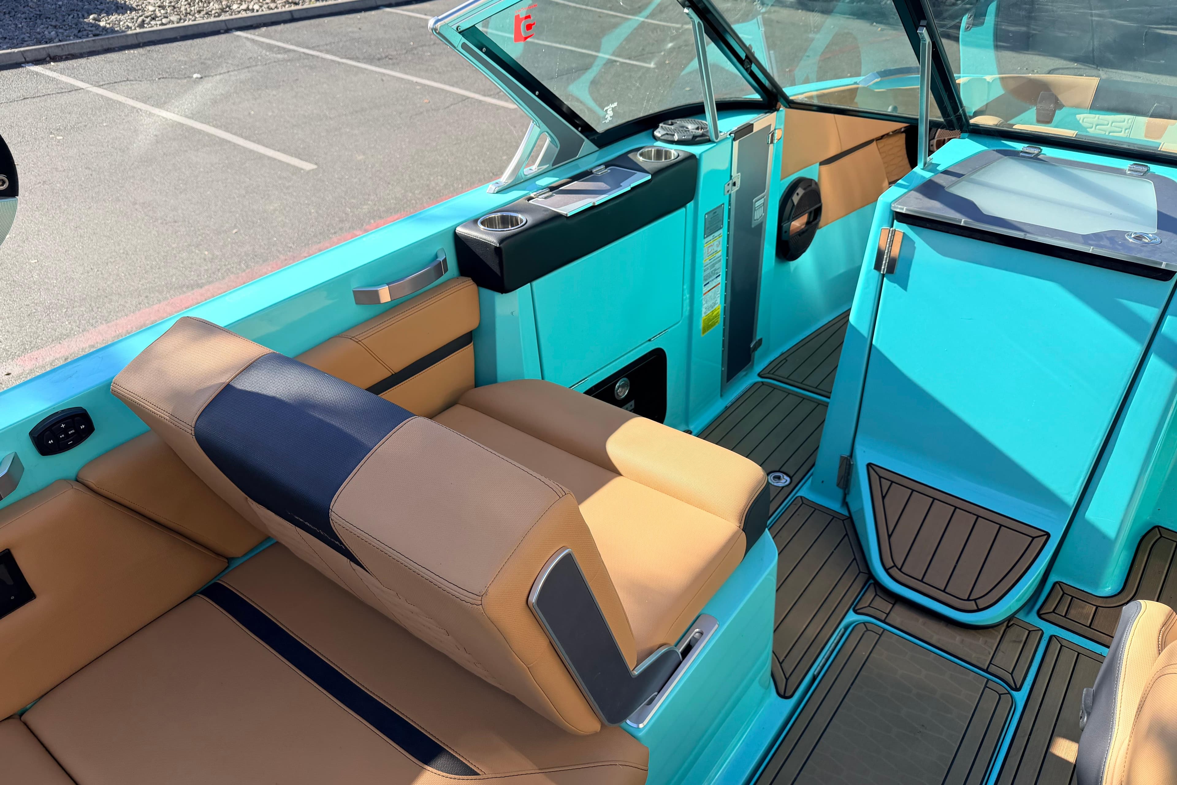 2021 MasterCraft X26 boat interior with tan and turquoise seating, modern design.