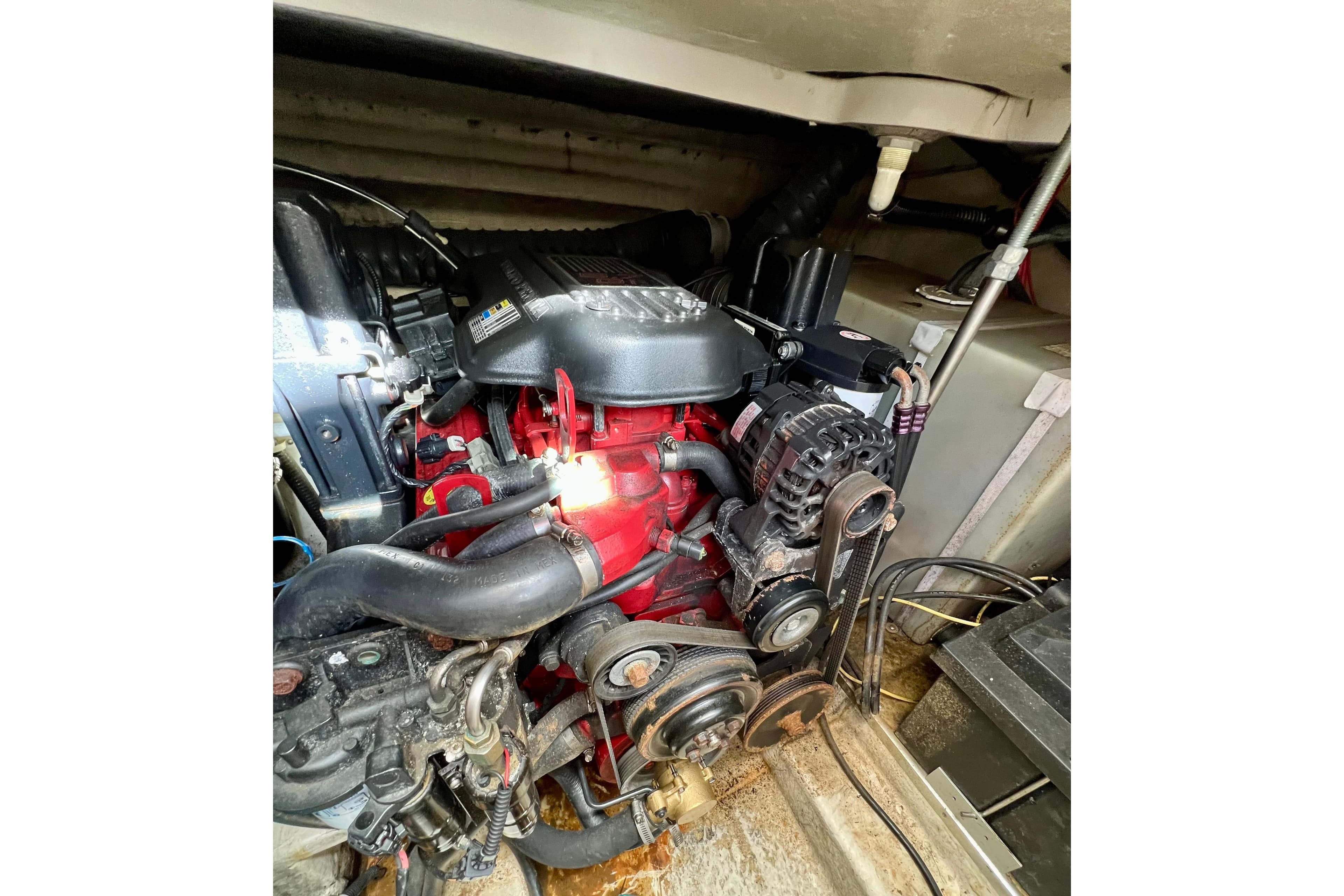 Engine compartment of a 2007 Larson Cabrio 310 boat, showcasing mechanical components.