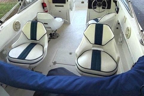 Interior of a 2001 Clearwater 2200 Dual Console boat with white and blue seating.