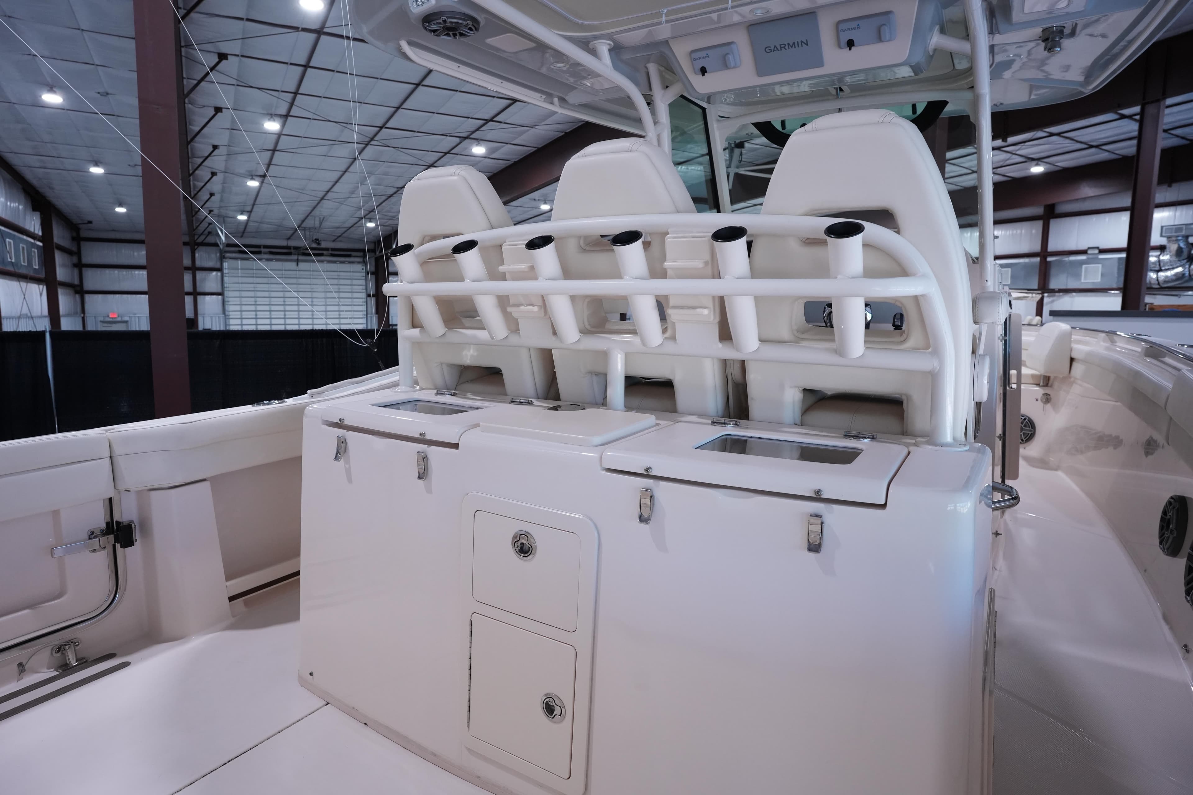 2023 Grady-White Canyon 336 boat interior with rod holders and storage compartments.