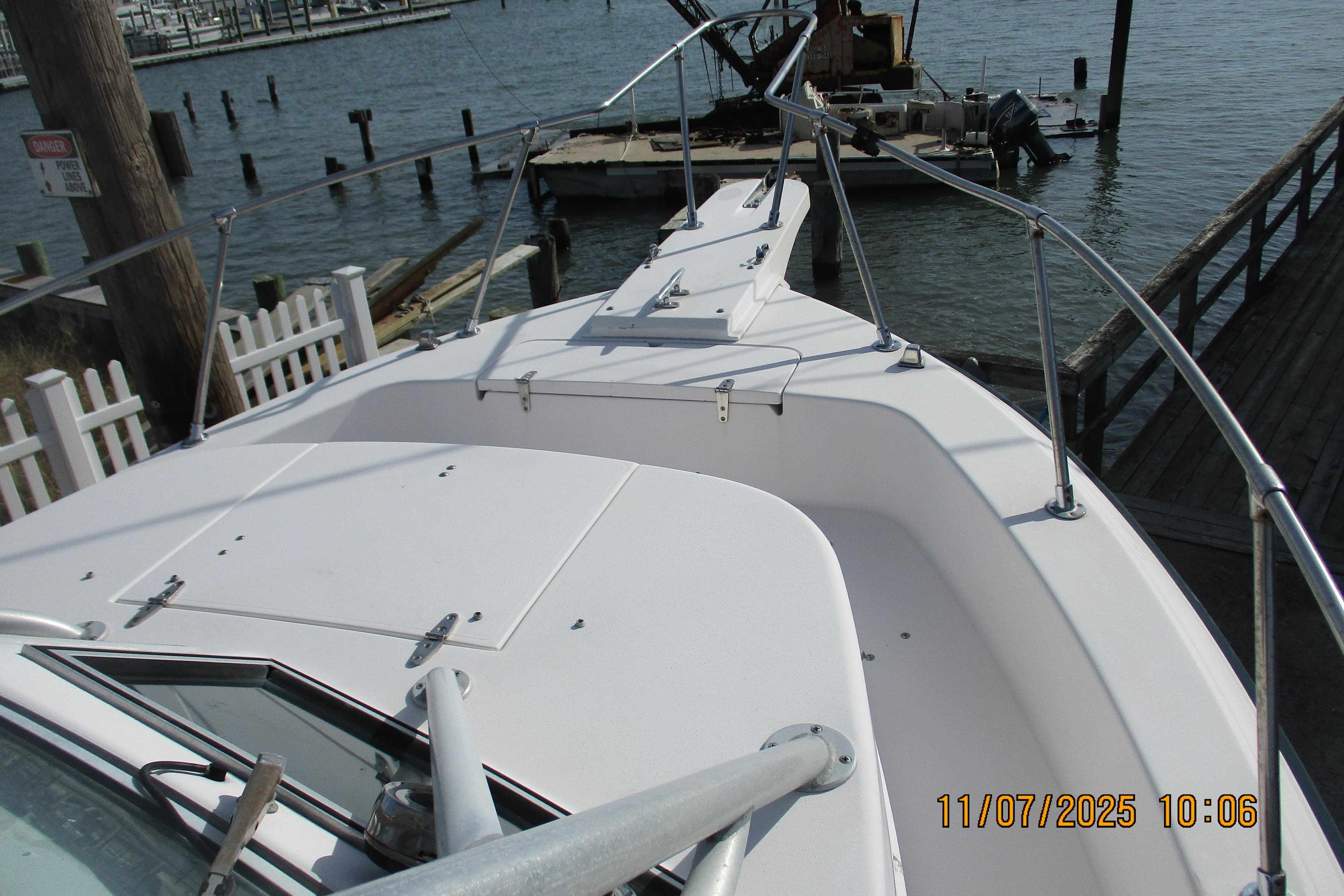 1996 Grady-White Sailfish 272 boat docked at a marina, viewed from the bow.