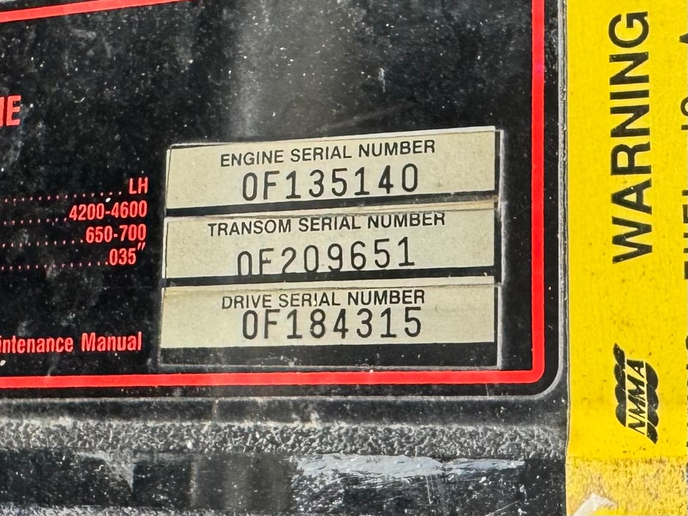 Serial numbers on a 1994 Cobalt 222 boat engine panel.