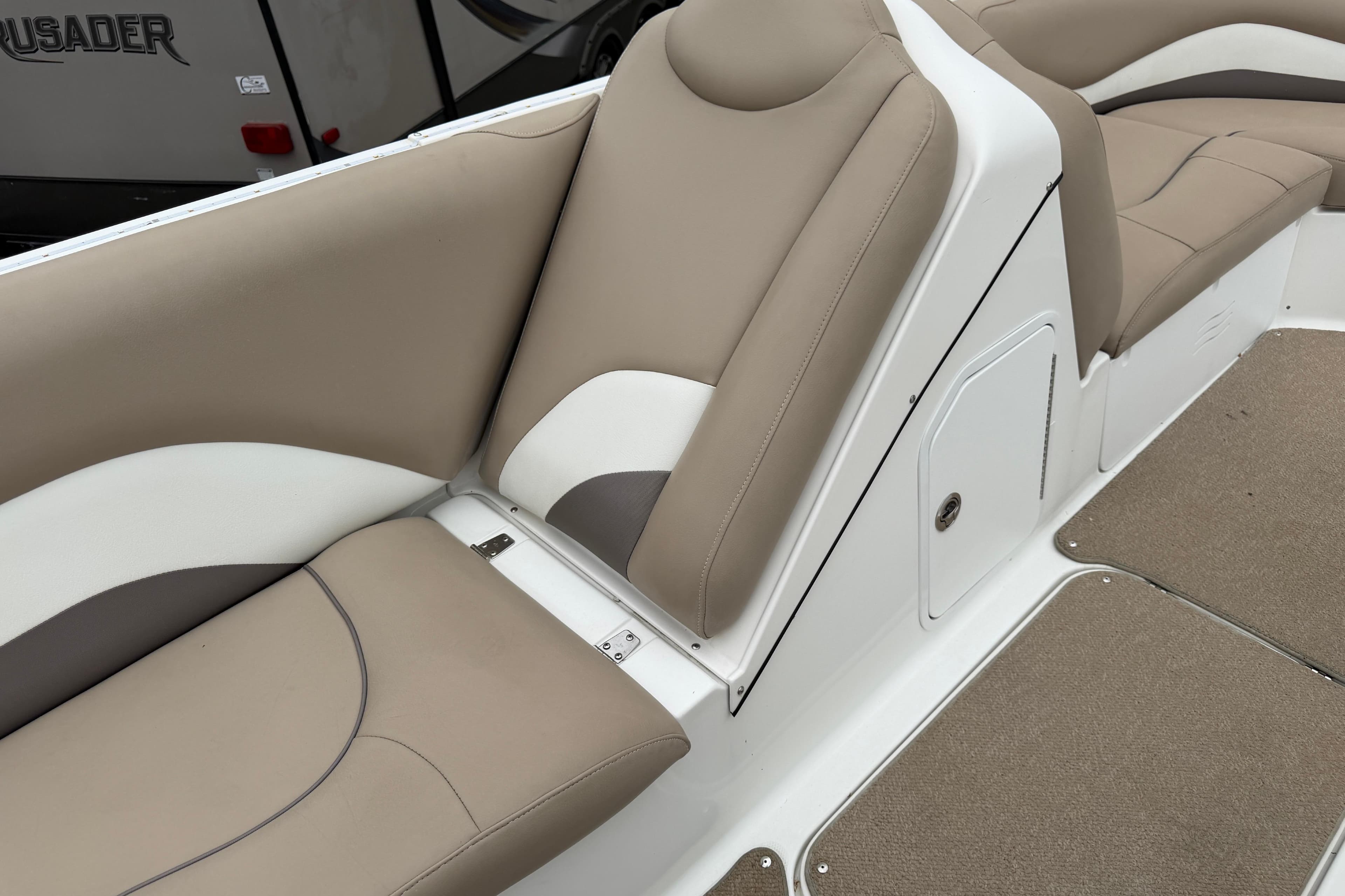 2016 Hurricane SunDeck Sport 202 OB boat interior with beige and white seating.