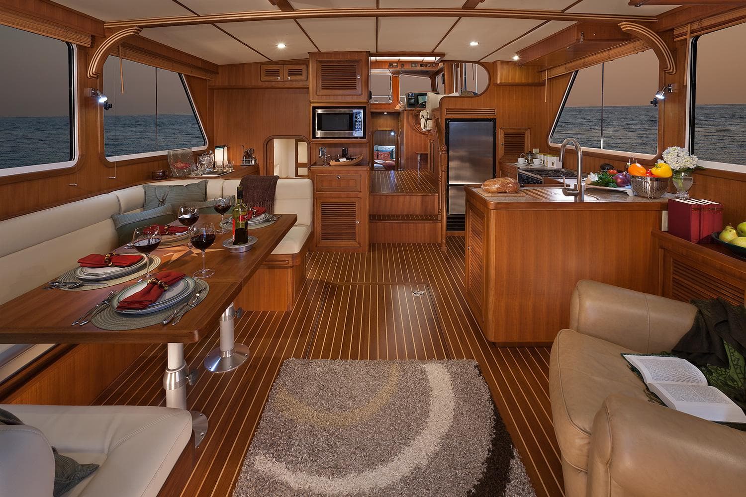 Luxurious interior of 2026 Helmsman Trawlers 43E PILOTHOUSE with elegant dining and kitchen area.