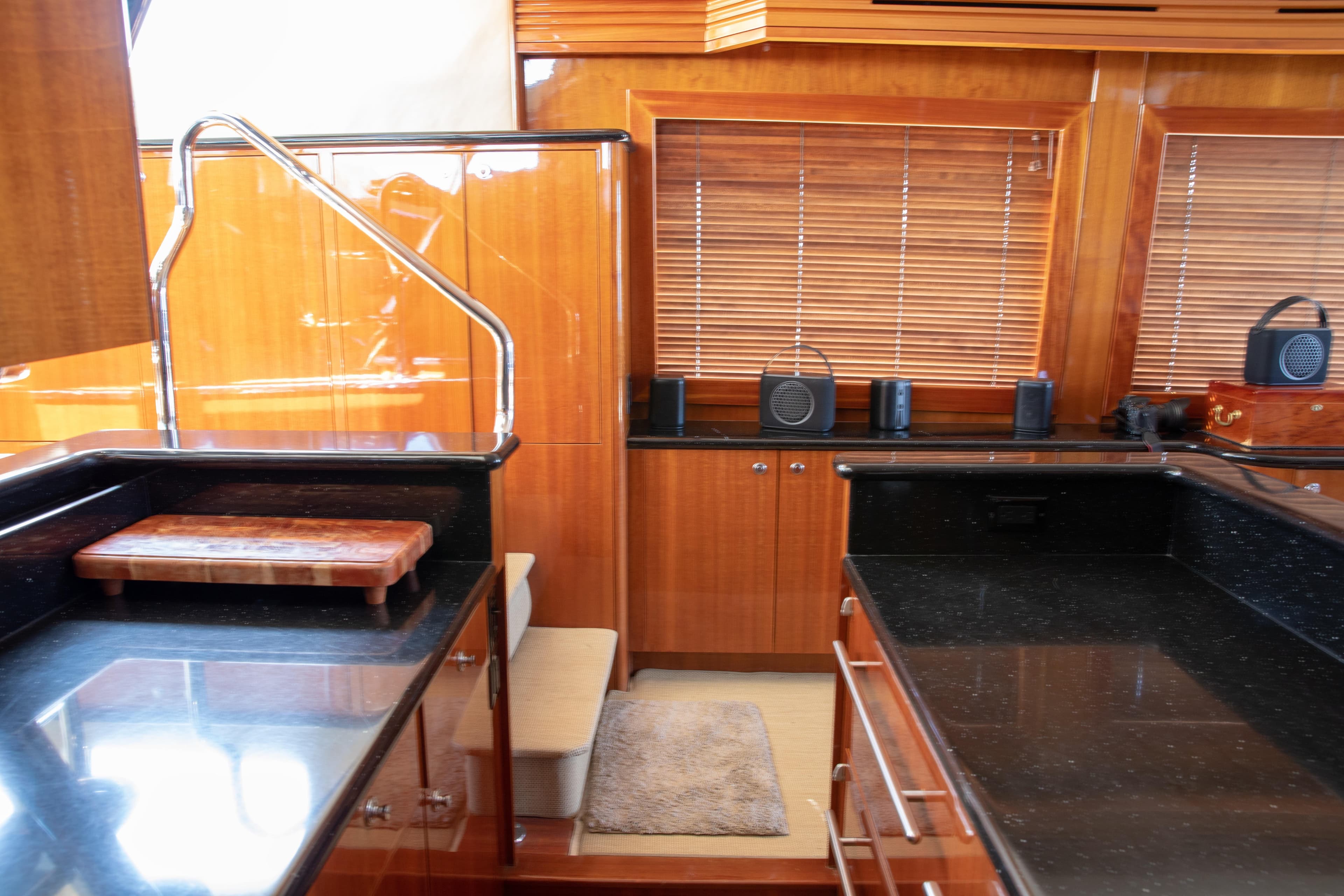 Luxurious kitchen interior of 2002 Hatteras 63 Raised Pilothouse Motor Yacht with wood cabinetry.
