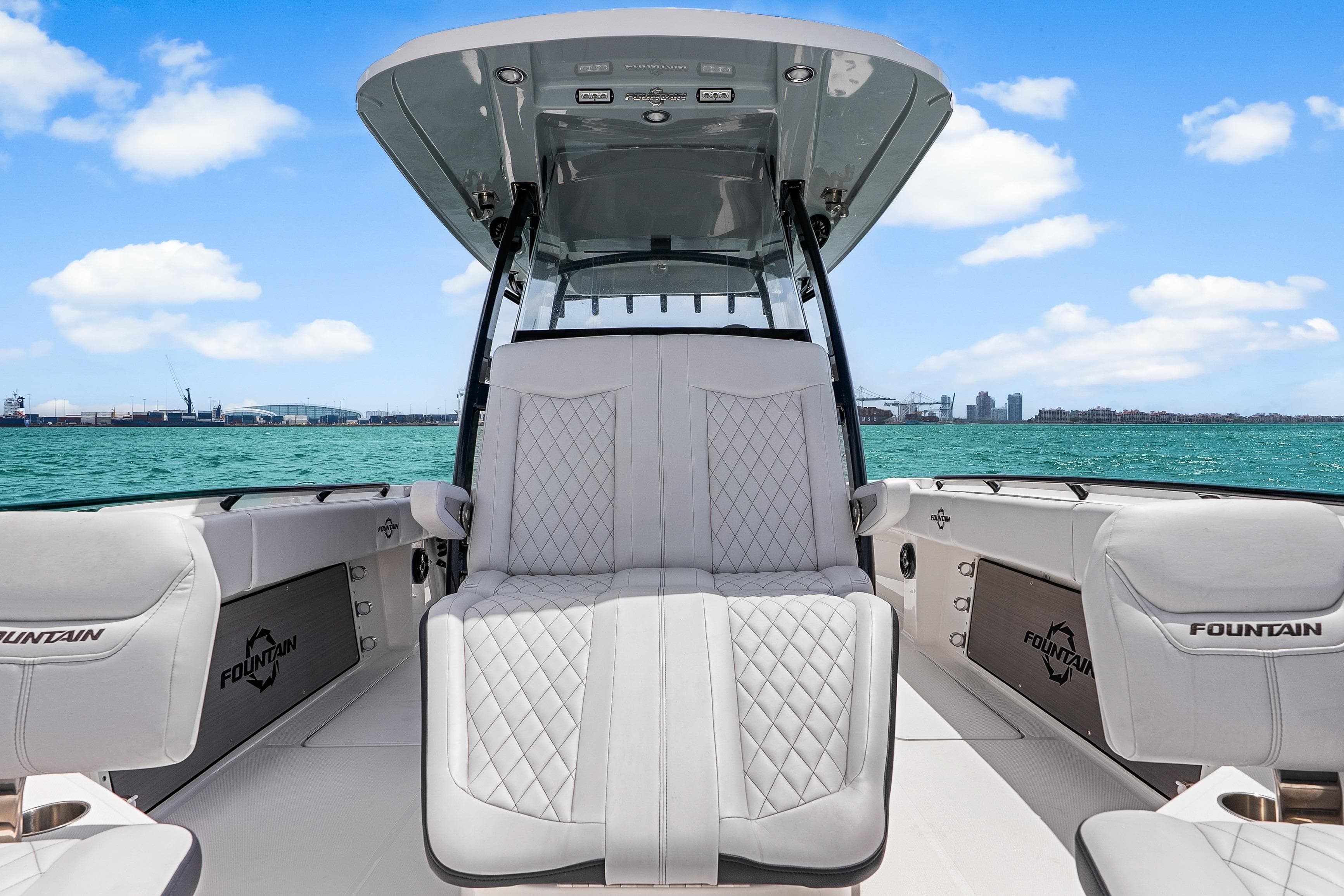 2025 Fountain 34 Center Console boat with luxurious seating on open water.