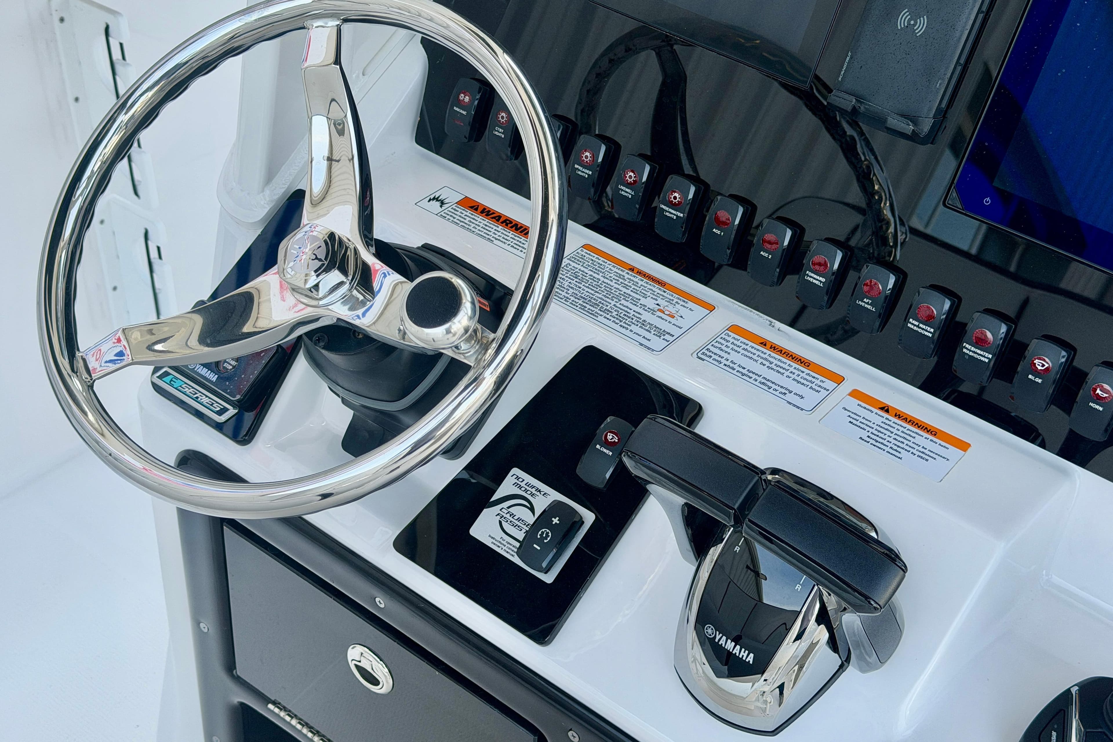 2026 Yamaha Boats 255 FSH Sport H dashboard with steering wheel and controls.