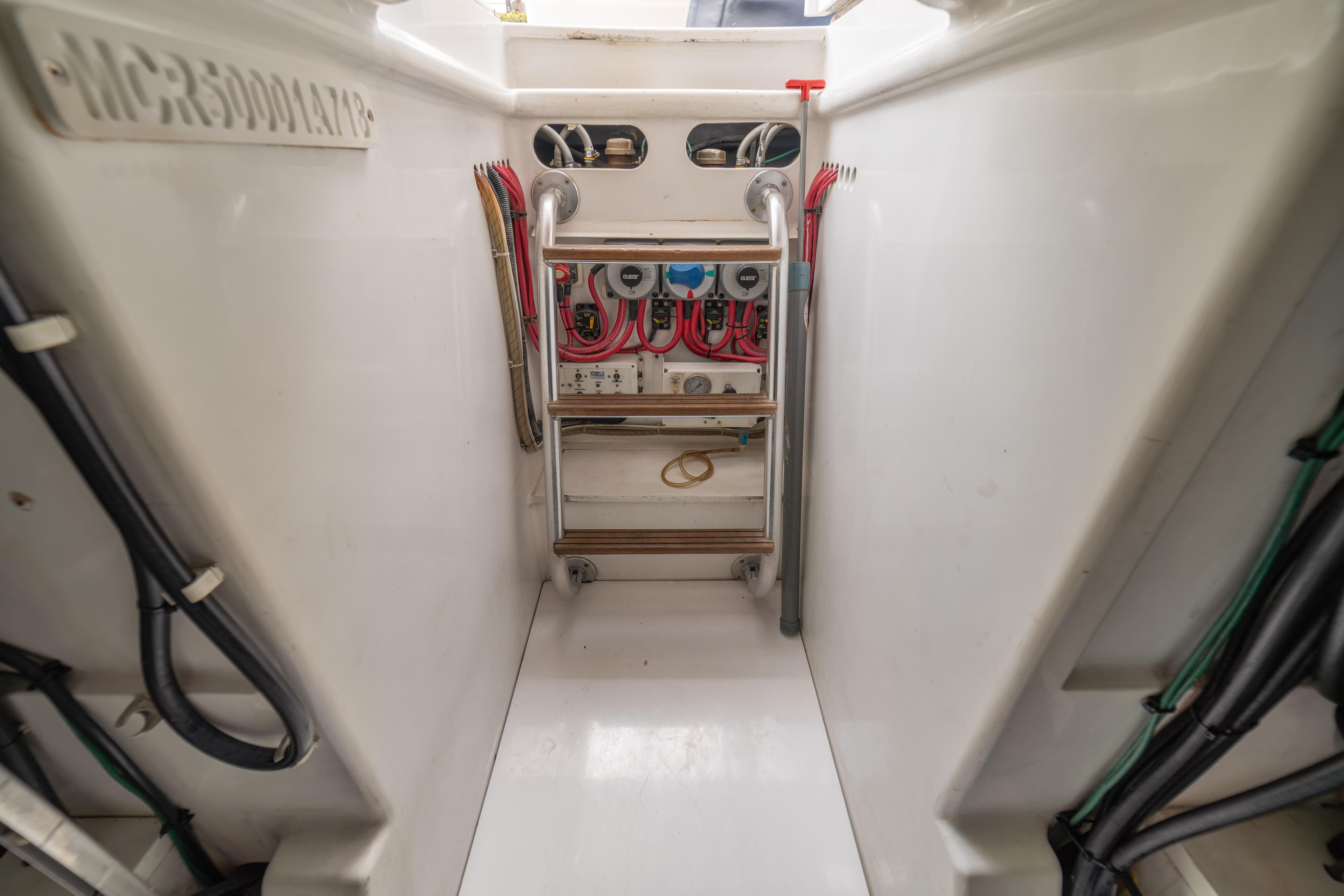 Engine room of 2018 Maverick Yachts Costa Rica 50 Sportfish, showcasing wiring and equipment.