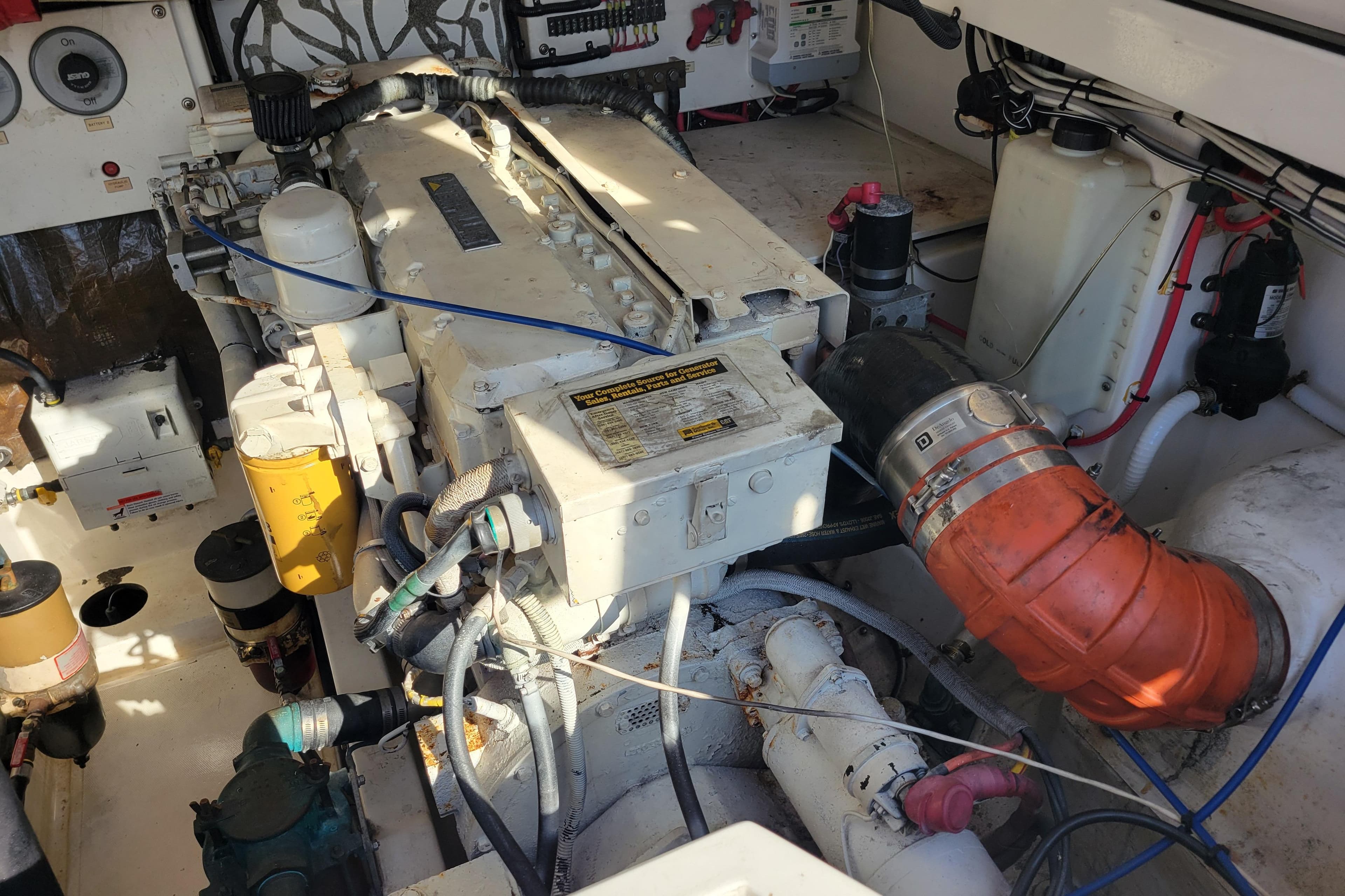 Engine room of 1998 Cabo 31 Express with Tower, showcasing mechanical components and wiring.