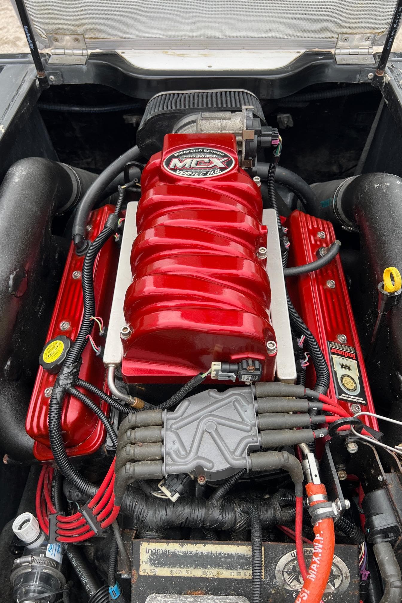2006 MasterCraft X1 engine with red components and MCX branding.