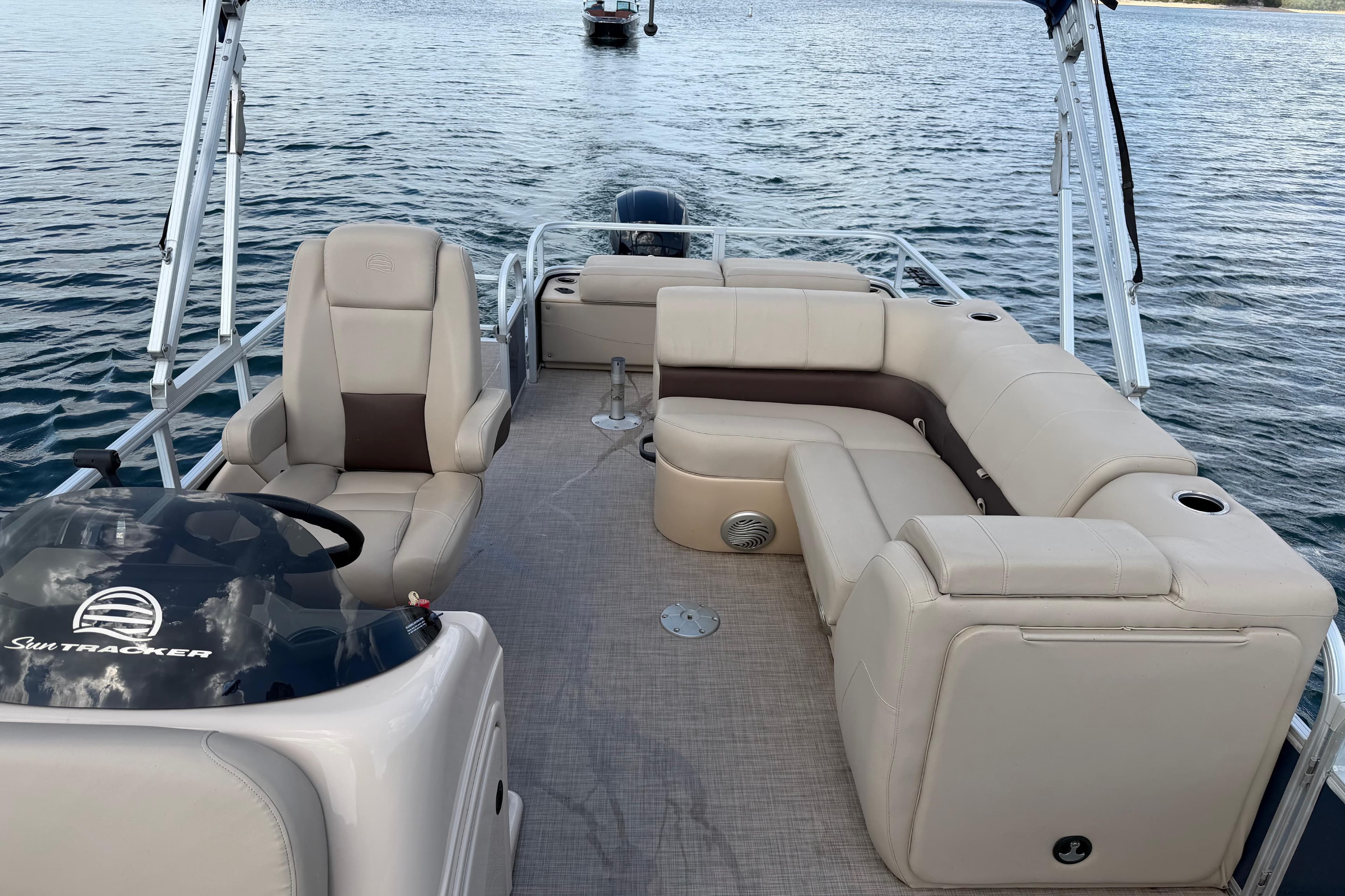 2019 Sun Tracker Party Barge 22 Sport Fish pontoon boat on water, featuring spacious seating.