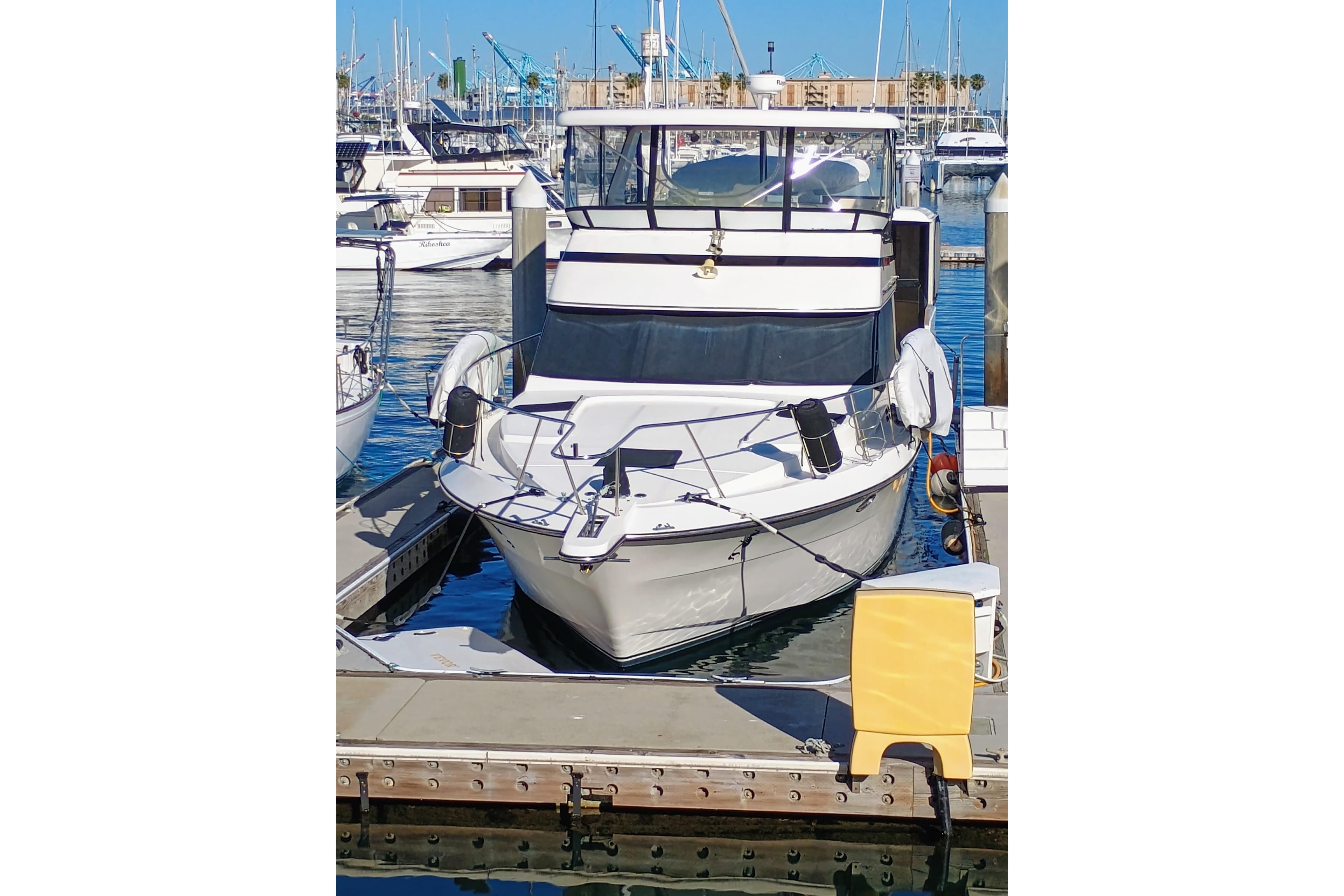 1988 Vantare 46' Aft Cabin Wide Body MY docked at marina.