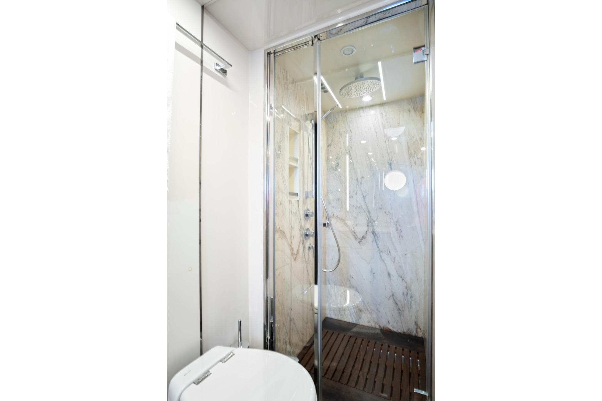 Luxurious bathroom in 2017 Azimut 72 Flybridge yacht with marble shower and modern fixtures.