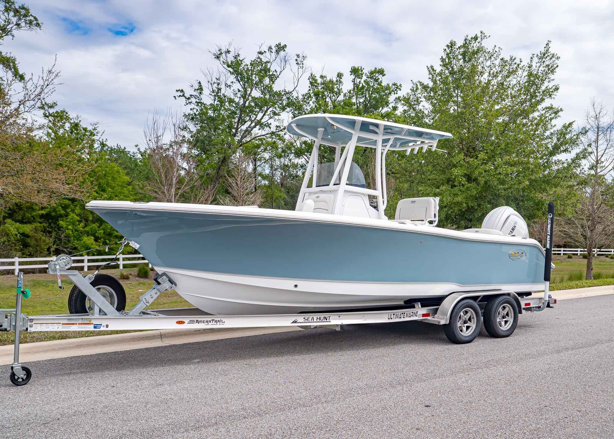 Sea Hunt Ultra 229 boat 2026 on trailer, side view.