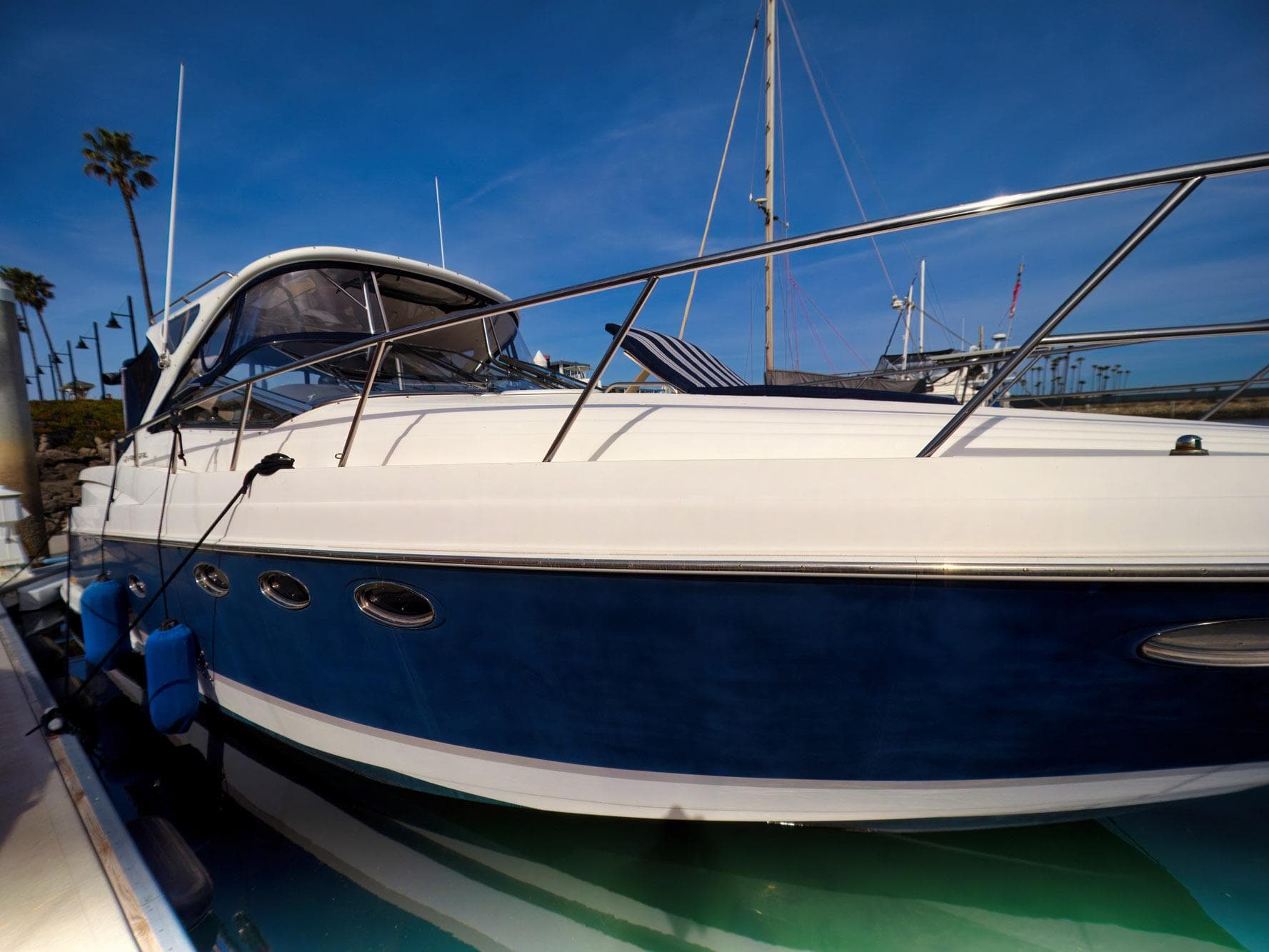 2008 Regal Commodore 4060 yacht docked under clear blue sky.