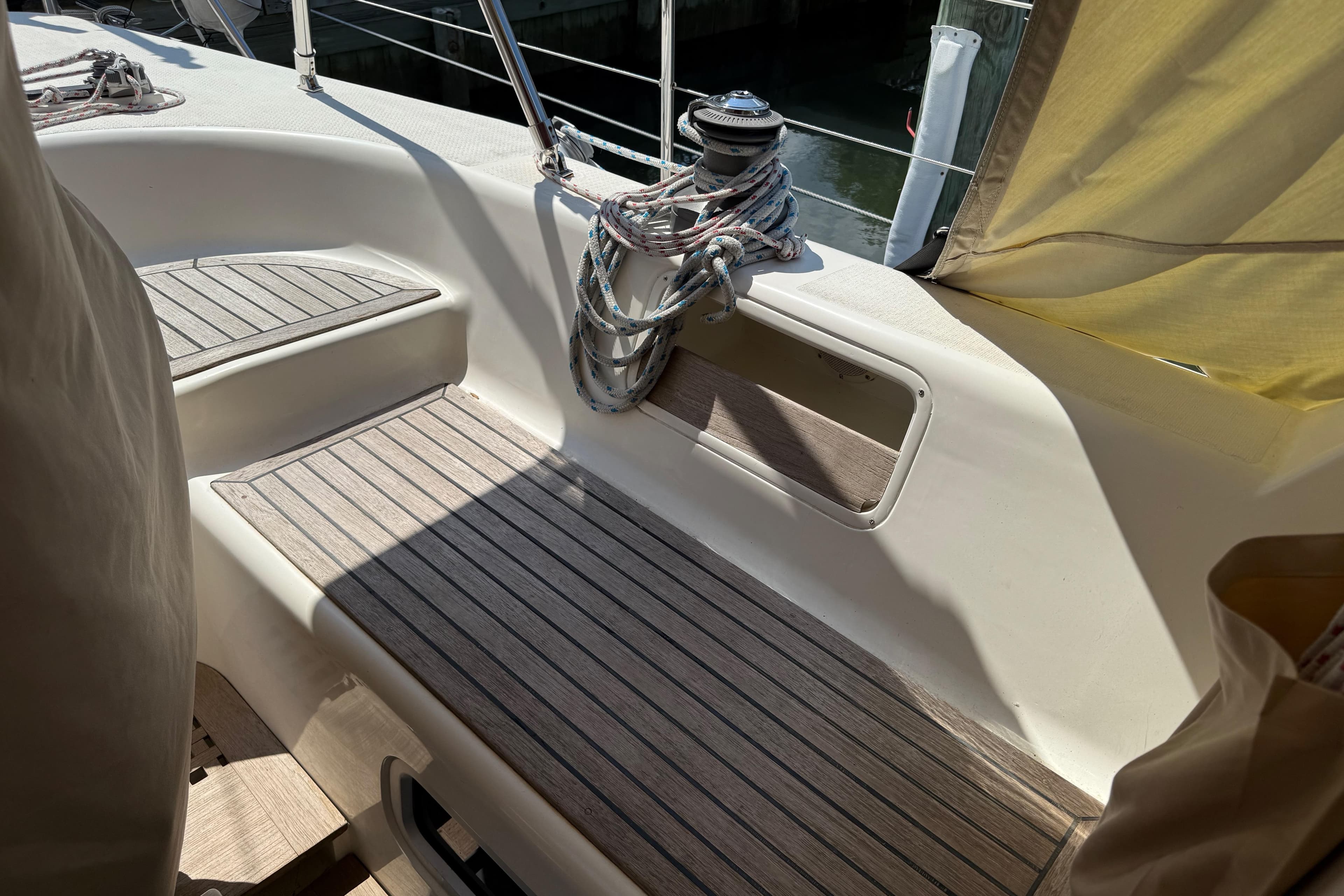 Cockpit of 2006 Southerly 115 Mk IV sailboat with wooden seating and winch.