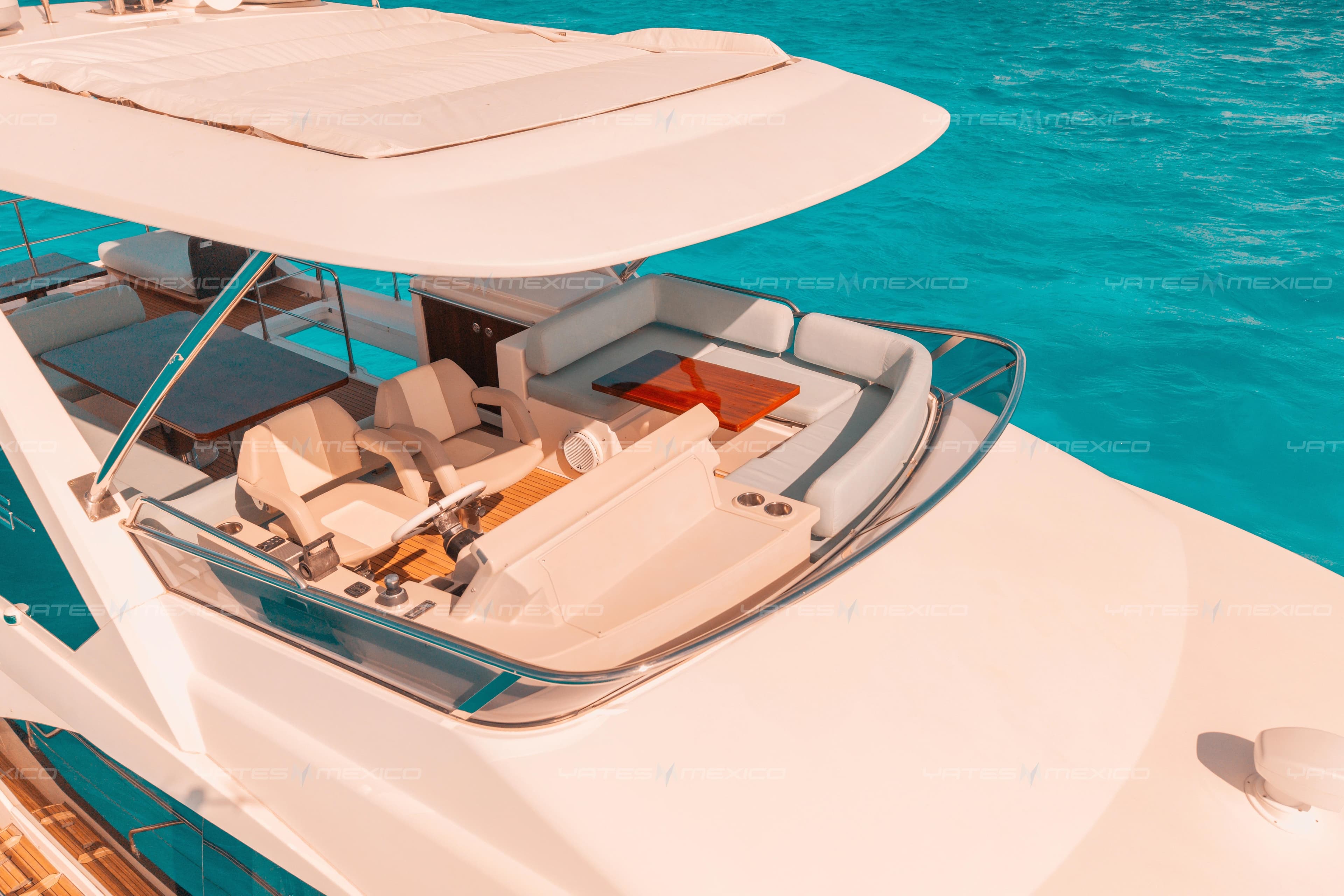 Luxurious 2017 Azimut 66 yacht with spacious deck and seating, cruising on turquoise waters.