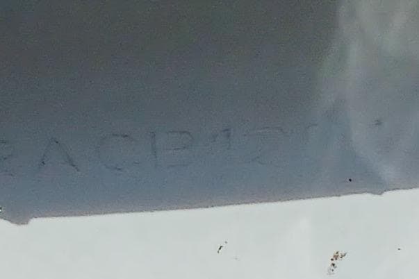 Close-up of a 2020 Leopard 40 boat hull with engraved serial number.