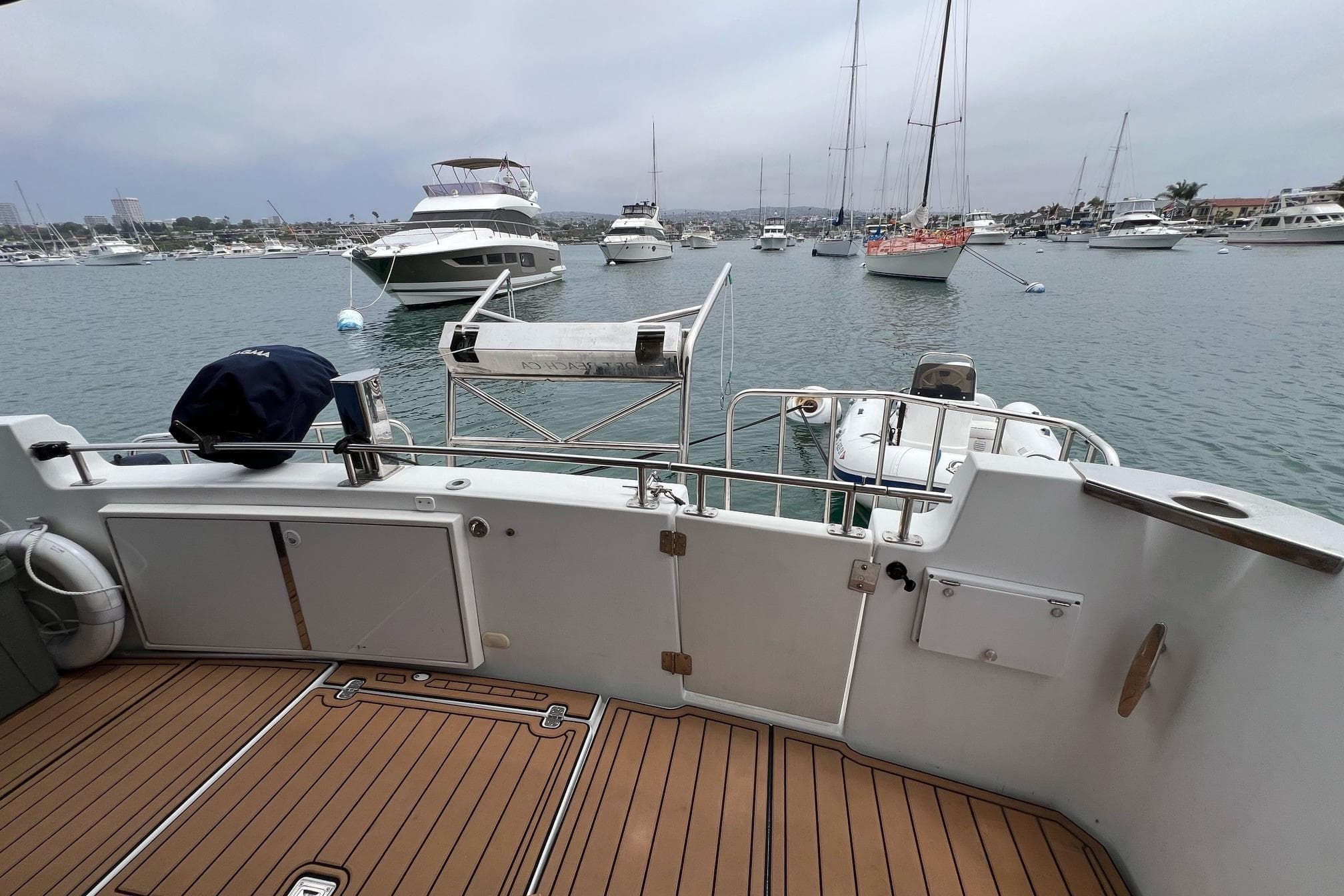 2003 Carver 444 Cockpit Motor Yacht docked in a busy marina.