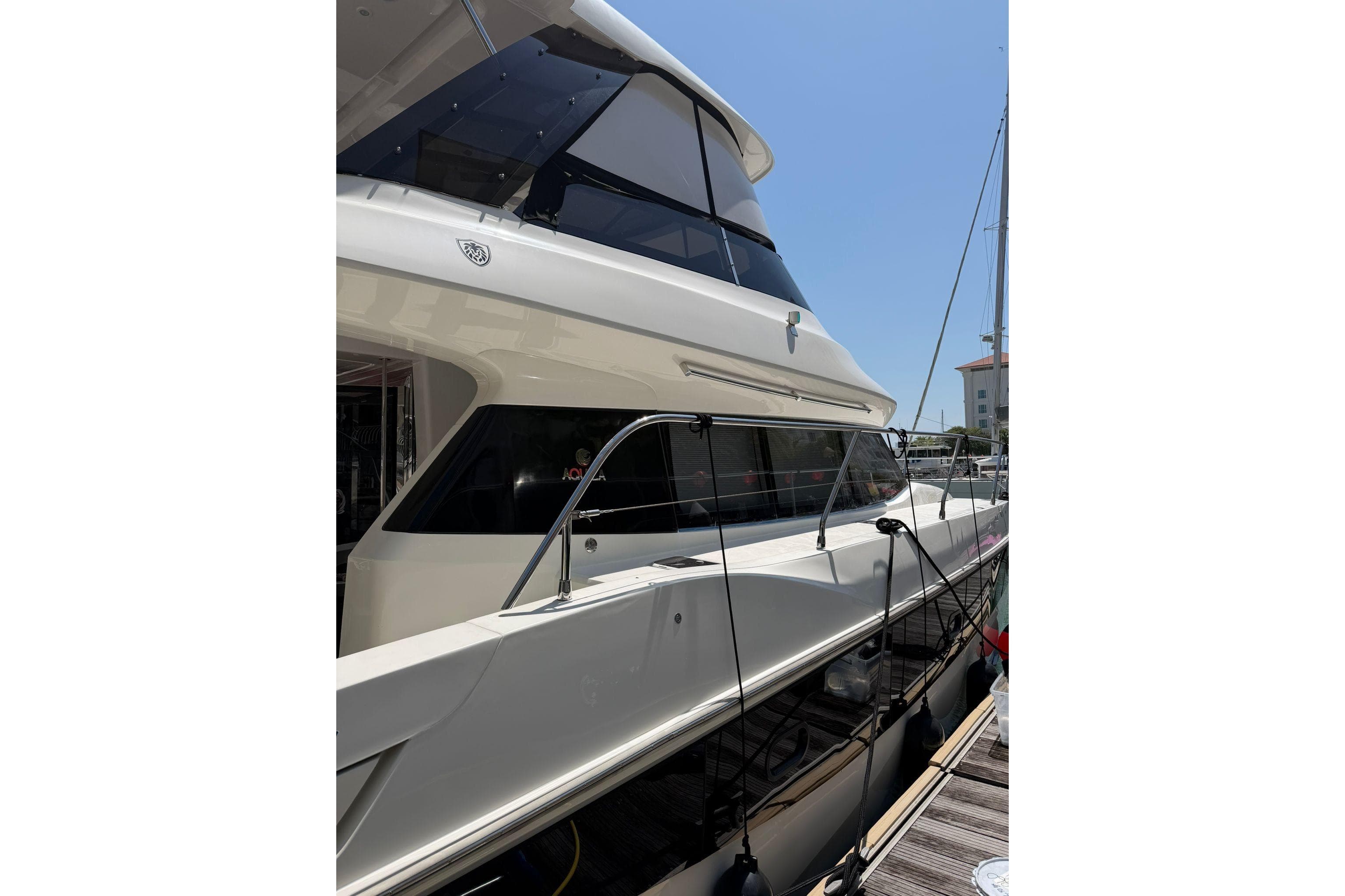 2023 Aquila 42 Yacht docked, showcasing sleek design and modern features.
