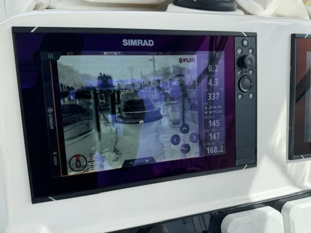 Simrad marine display on 2008 Pro-Line 32 Express boat, showing navigation and thermal imaging.
