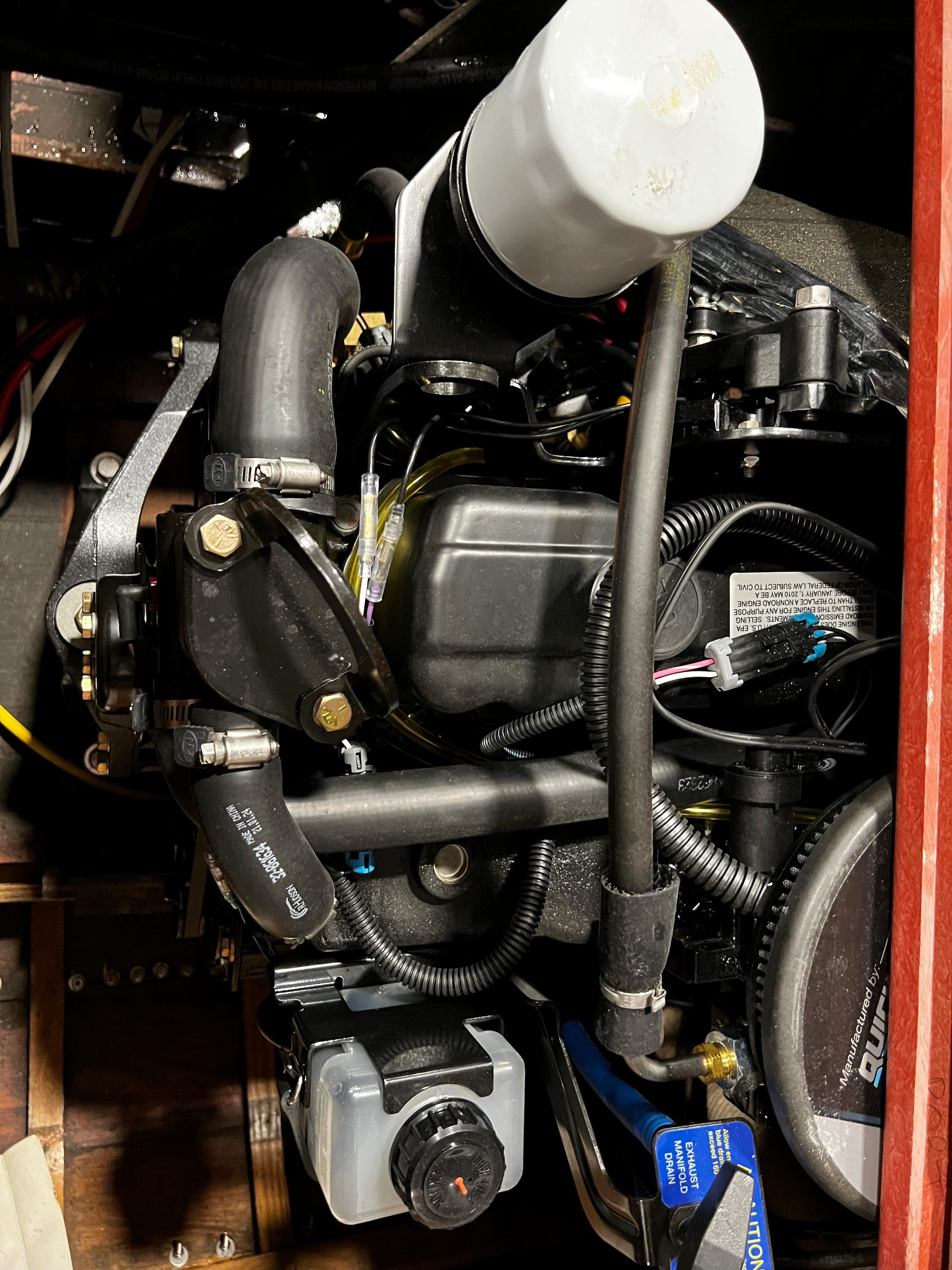 Engine compartment of a 1981 Skiff Craft 260 boat, showcasing mechanical components.