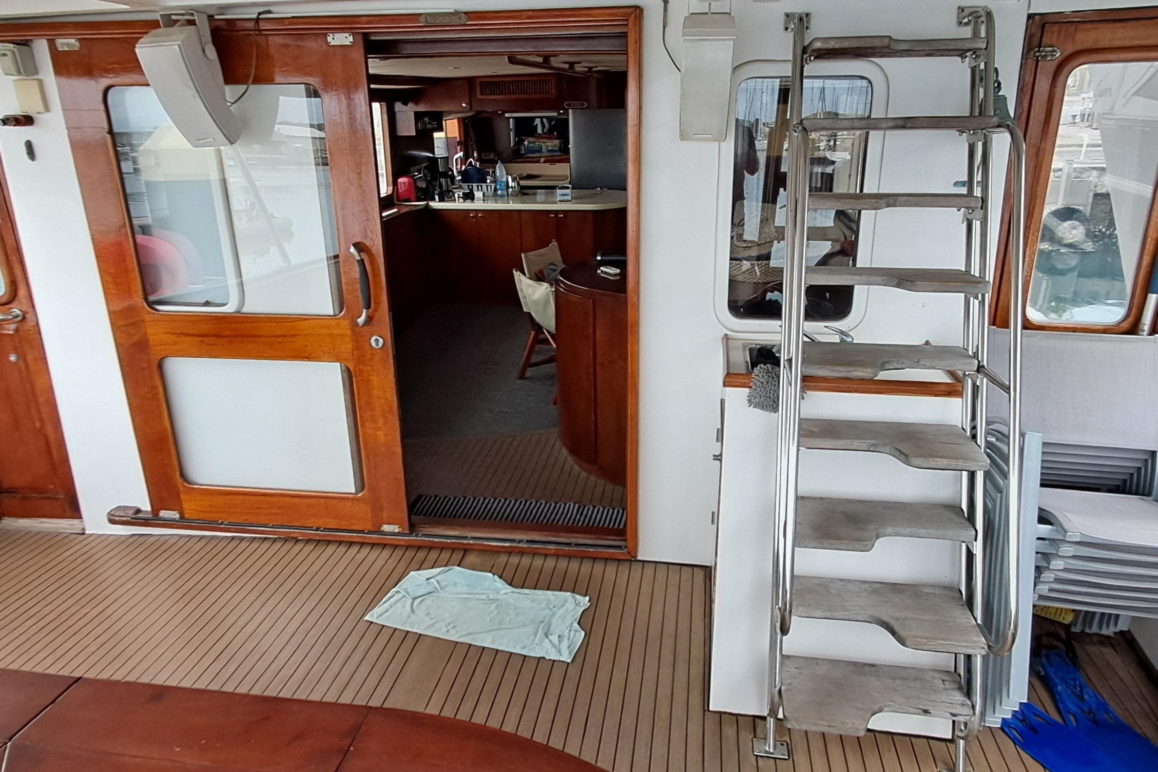 2003 DeFever 57 POC yacht interior with wooden doors and metal stairs.