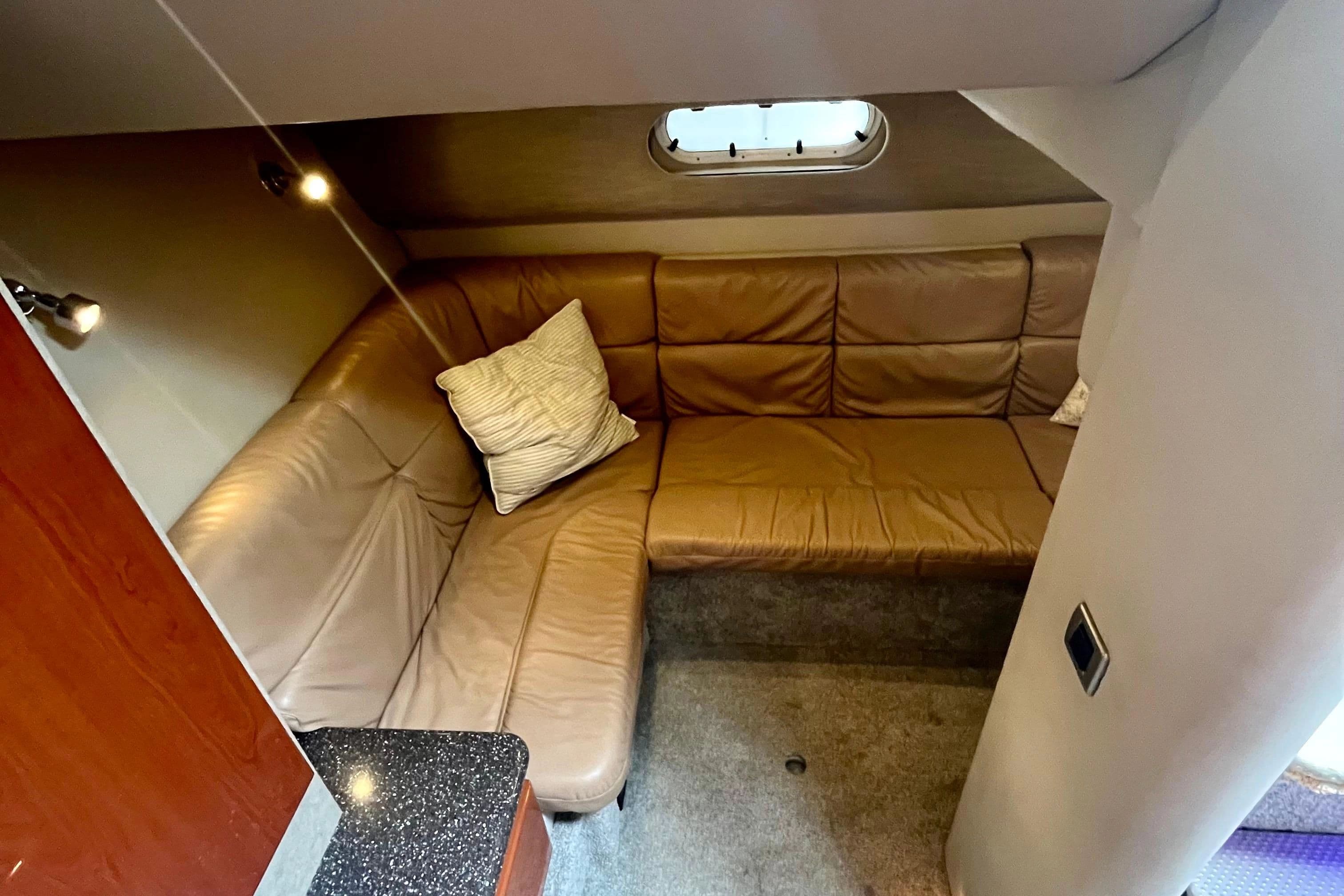 Interior of a 2006 Formula 37 Performance Cruiser with leather sofa.
