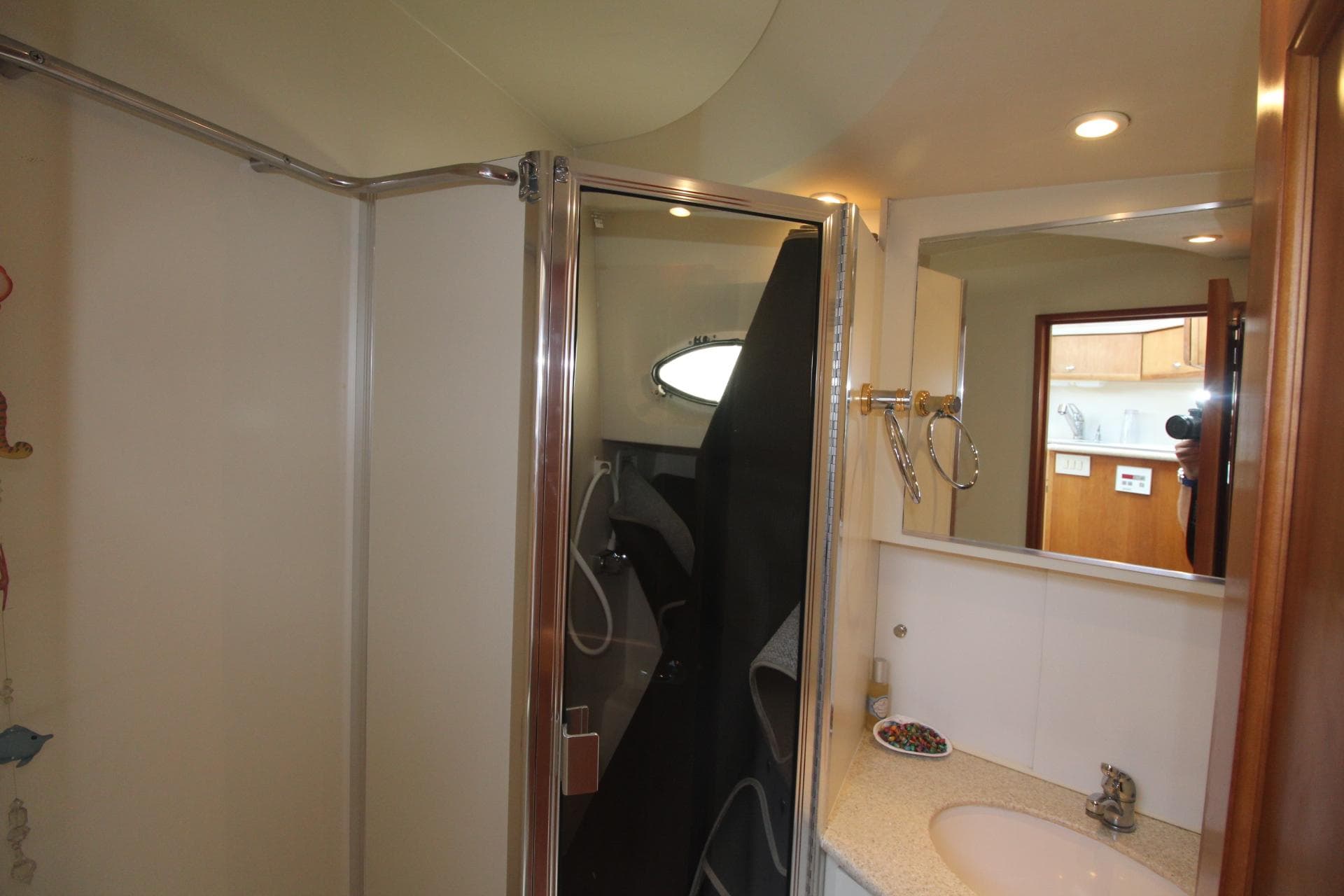 Bathroom interior of 2000 Silverton 392 Motor Yacht with shower and sink.