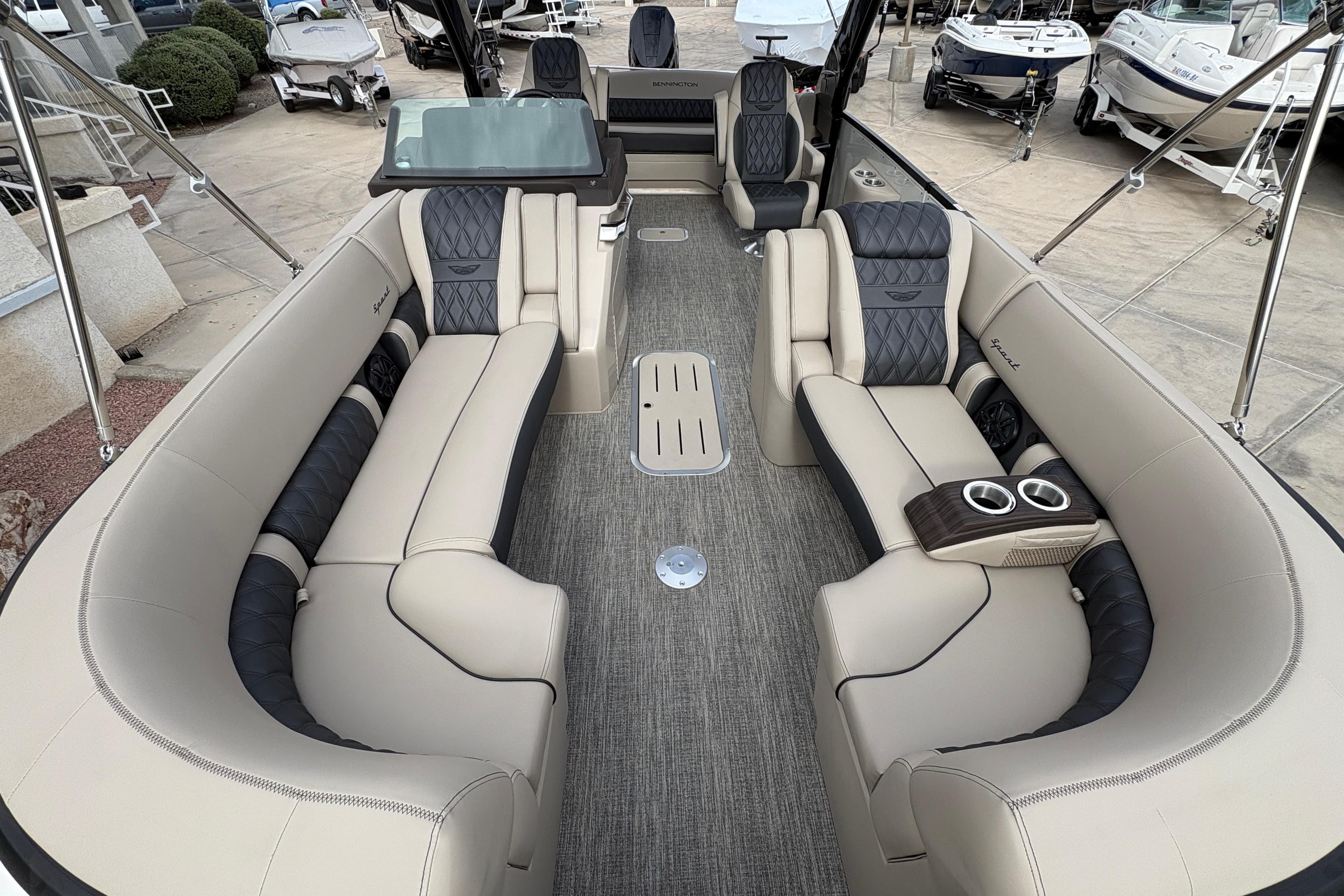 Luxurious interior of 2026 Bennington 25 QXSBA pontoon boat with plush seating.