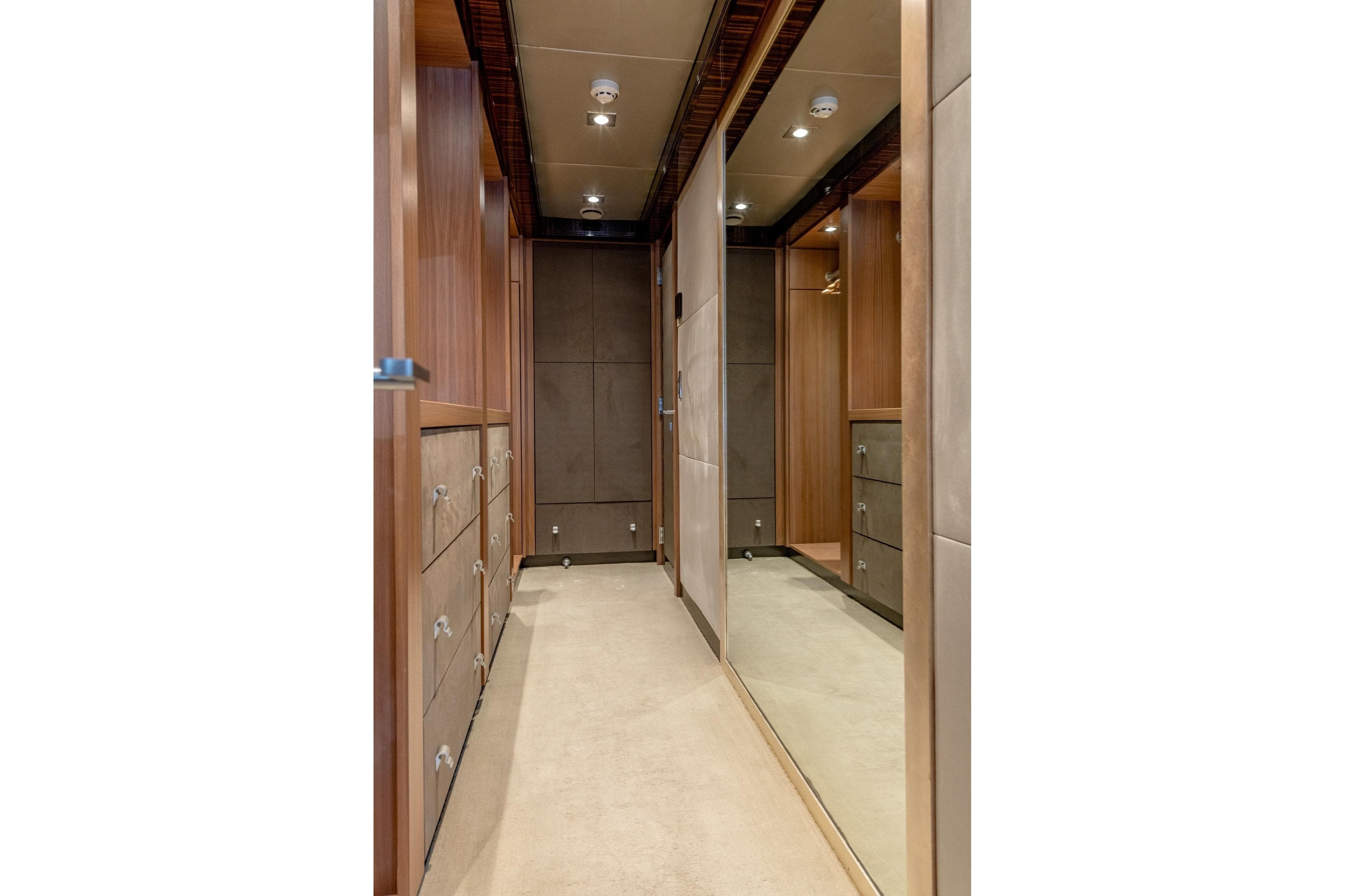 Luxurious wooden interior of 2008 Palmer Marine PJ150 yacht, featuring elegant cabinetry and lighting.
