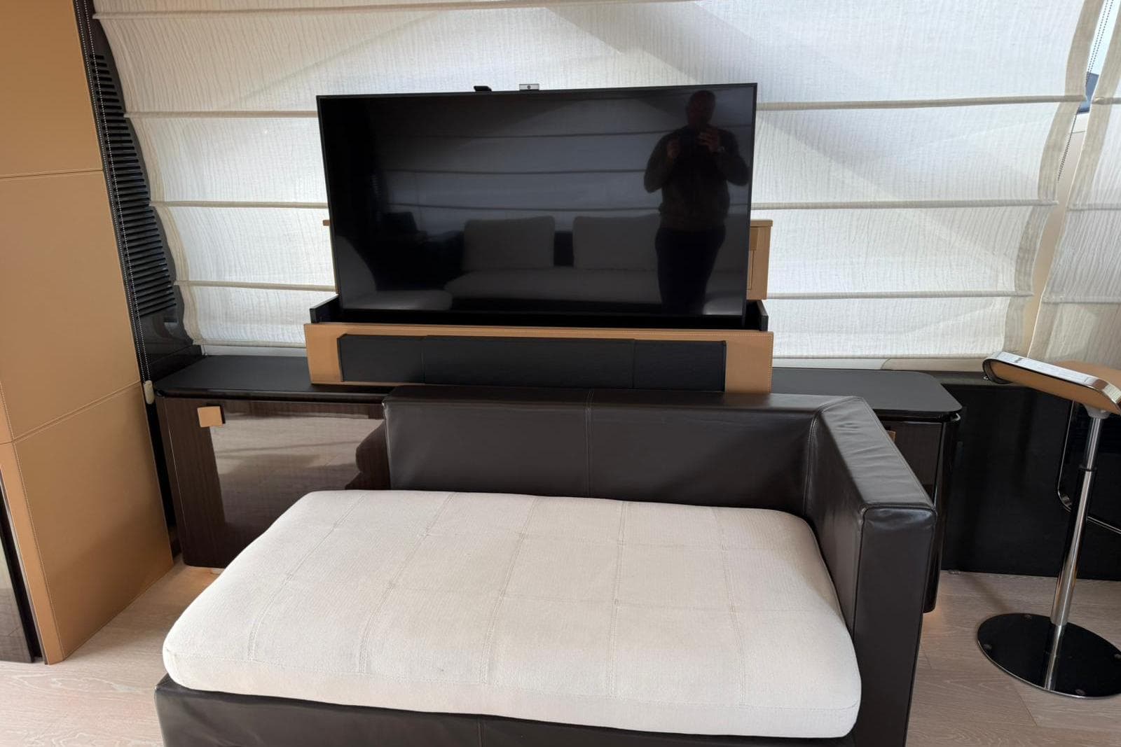 Luxurious interior of 2016 Azimut 77S yacht with modern TV and stylish seating.