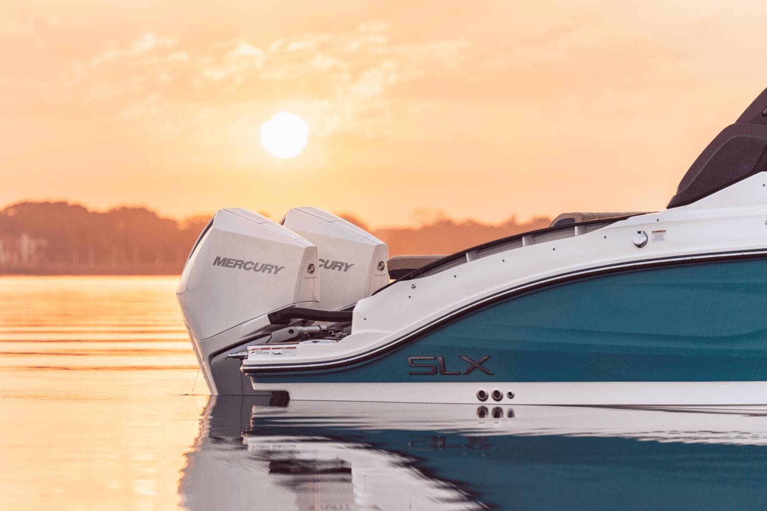 2024 Sea Ray SLX 280 Outboard boat at sunset on calm water.